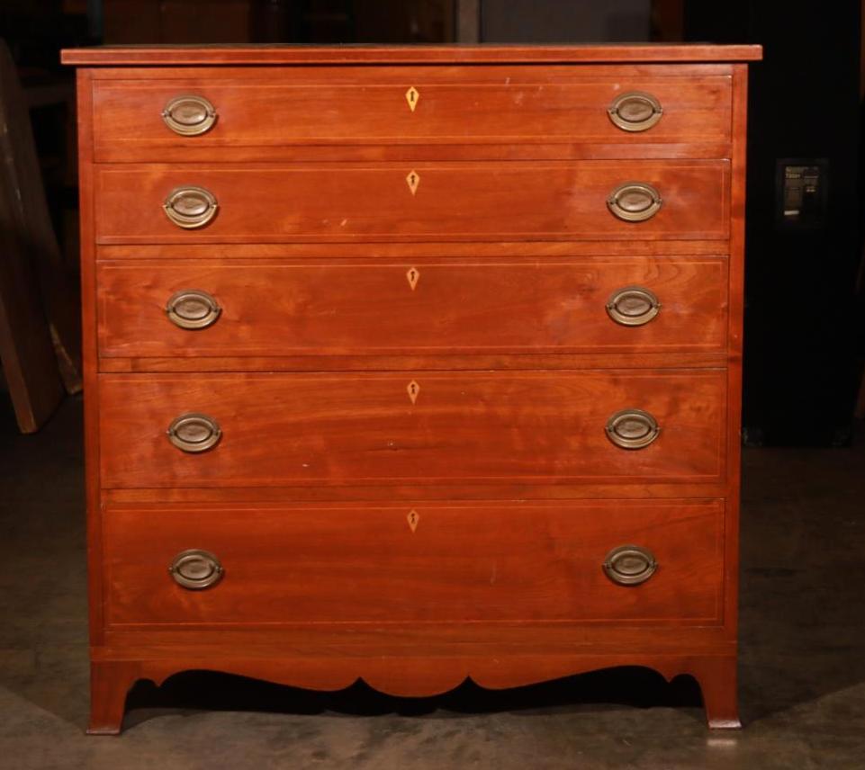 Chippendale/Queen Ann Mahogany Hyacinth Locking Dresser: This impressive Chippendale Style Mahogany with grape hyacinth embezzled handles features 5 full-length drawers of various declining heights. While there are locks, the key is not included. There will
