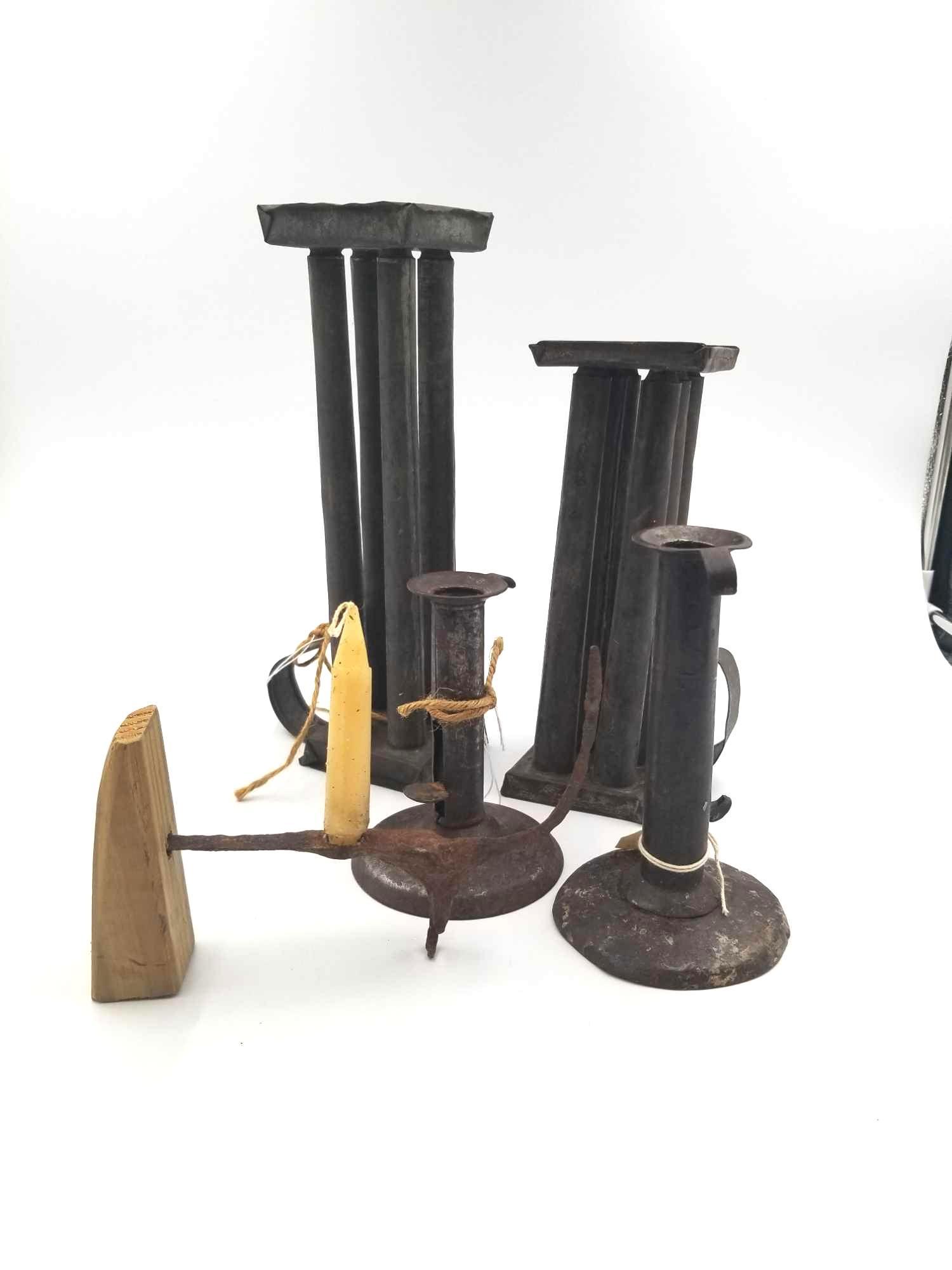 Vintage Candle Mold and holders: This box lot includes 1 - 4 pc tin candle mold, 1 - 6 pc tin candle mold, the 1800s 2 hog scraper push up candle holders, and old hand made candlestick. Width: 3 Length: 4 Height: 9