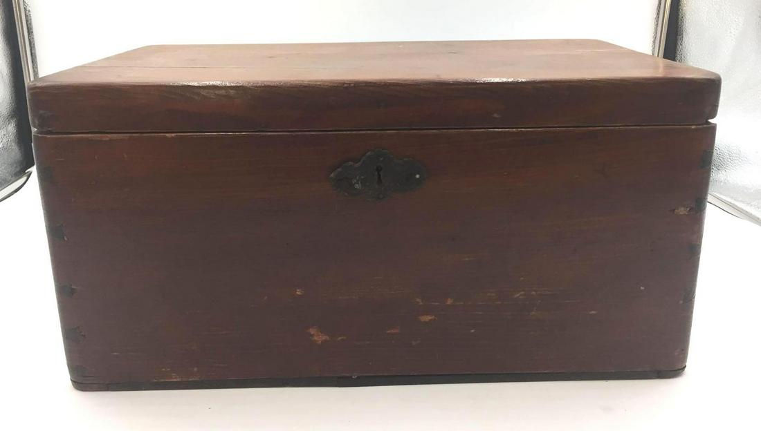Big Wooden Box with Knife Inside: The top of the box opens to place a chunk of sugar in. The chopper is used to chop the sugar into fine granules, which slip through the holes in the top part of the box. The sugar can then be used in