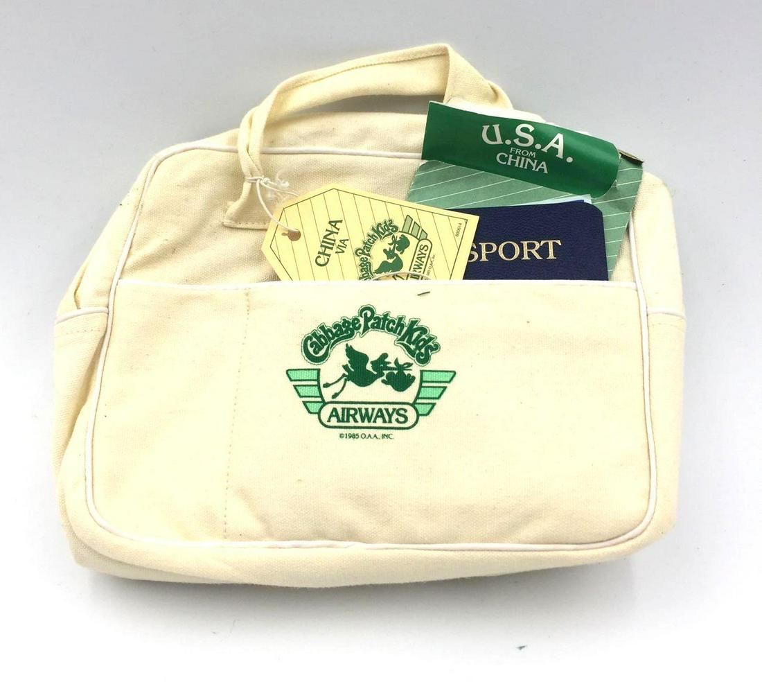 1985 Cabbage Patch Kids World Traveler Bag - China: This lot includes a designer luggage bag accessory, t-shirt accessory, passport, travel brochure, and airline ticket accessory. The lot is in good condition with no stains.