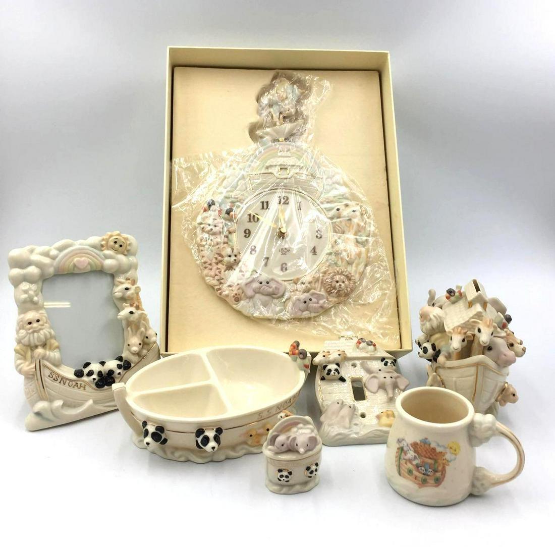 Lenox 7 pc Noah's Ark Baby Set: This lot contains a wall clock, picture frame, light switch cover, change bank, tooth fairy box, and a cup and bowl set all Noah's Ark themed. All pieces are in great condition with no cracks or chips