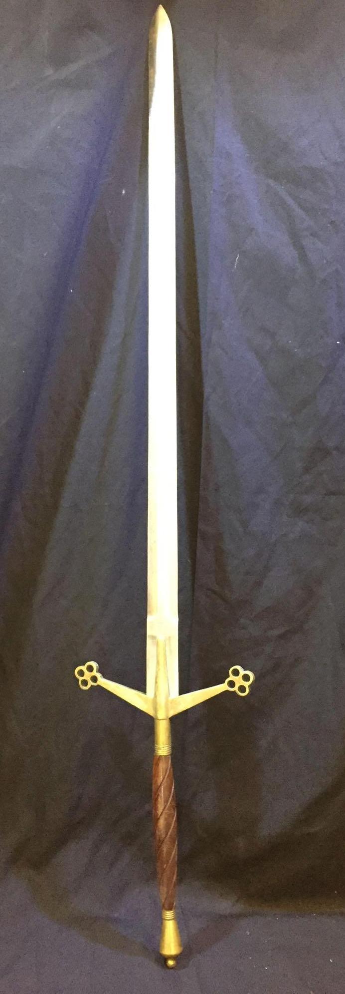 Pakistan Steel Claymore/Greatsword: This massive replica Claymore features an impressive surgical steel blade sitting at 42 inches in length. The bronze guard has an elegant honeycomb pattern to accentuate the grip. The grip is a is ma