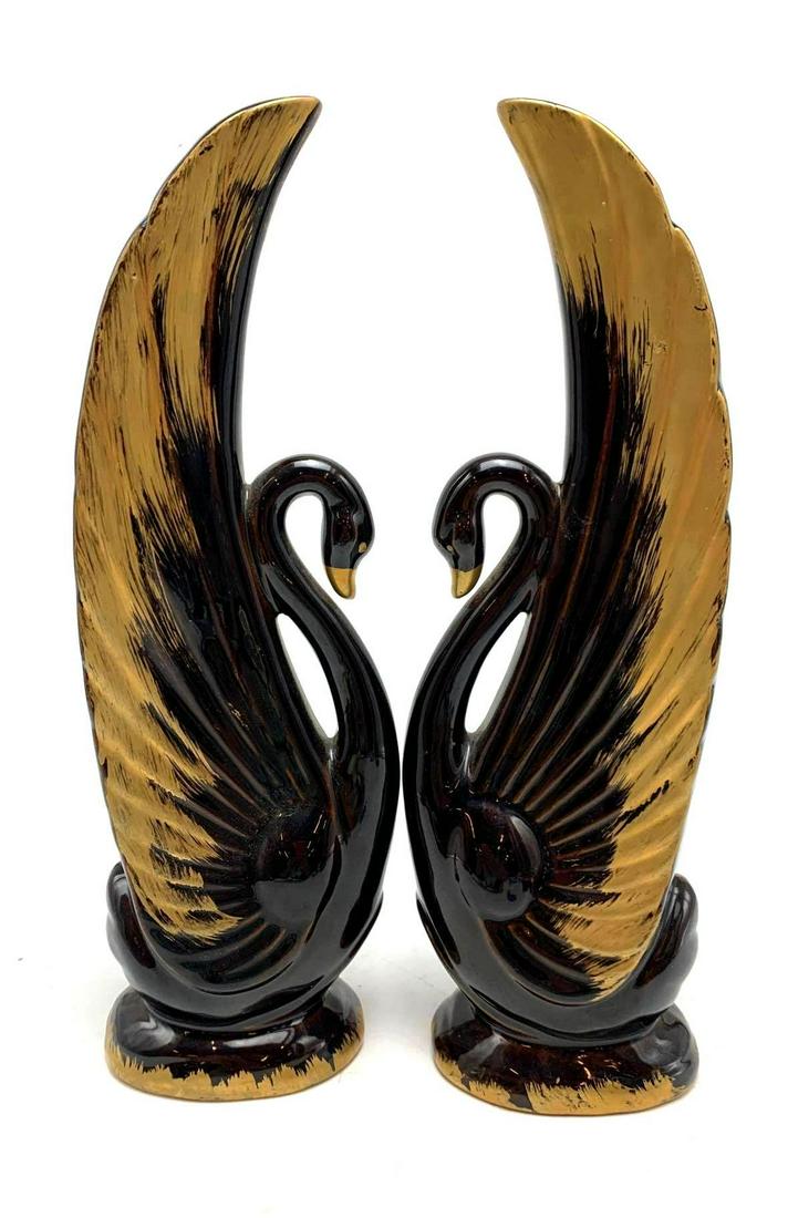 Pair of Swan Figurines: Pair of Swan Figurines. Pair of black swan clay figurines with hand painted gold tipped wings and beaks. Approximately 13 inches tall, 4 inches long, and 3 inches wide. Made in Japan.