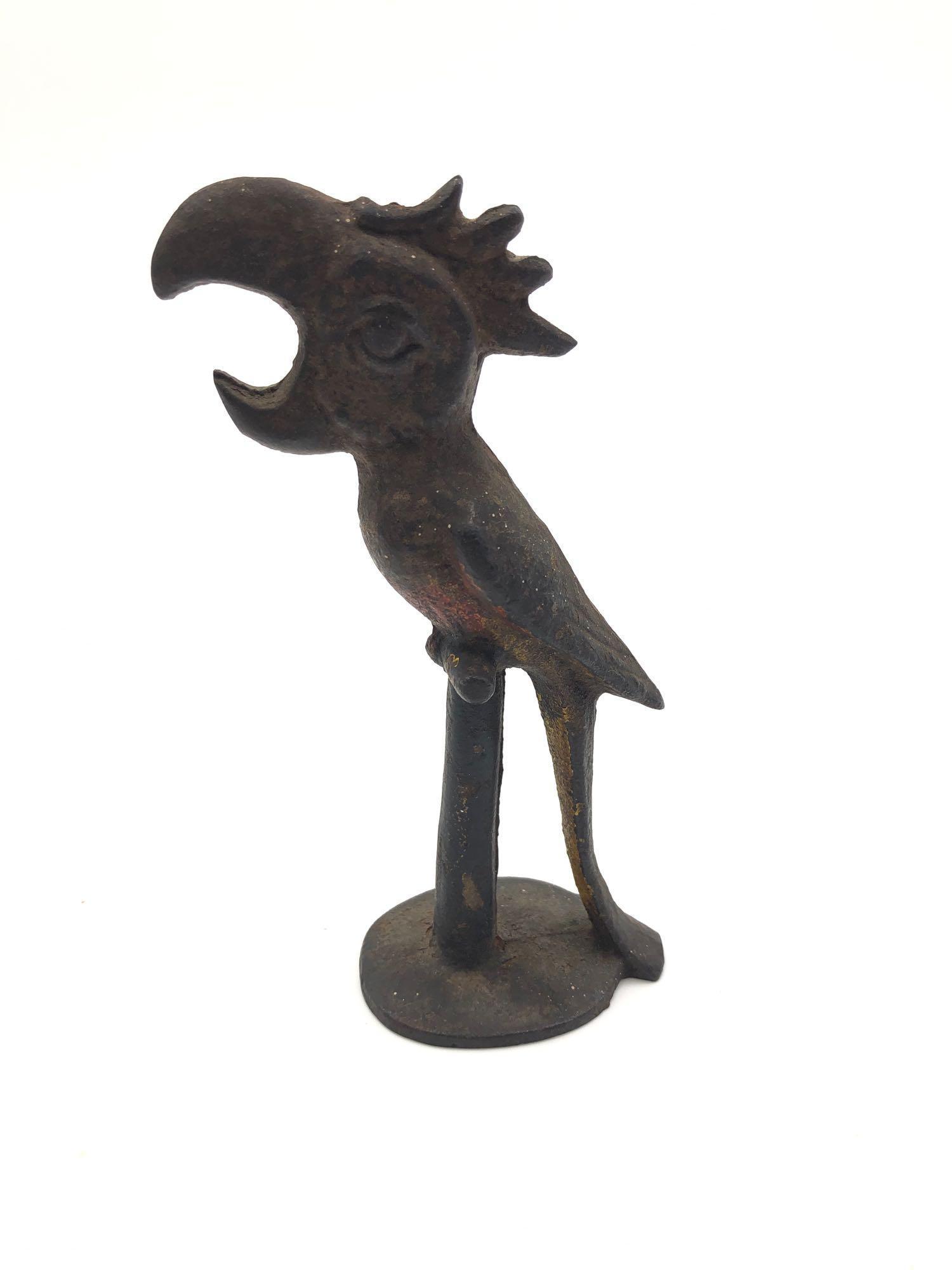 Vintage Cast Iron Toucan Bottle Opener: Vintage Cast Iron Toucan Bottle Opener Figural parrot/toucan bird bar bottle opener. Made from cat iron and has remnants of original paint. Approximately 5.5 inches tall.