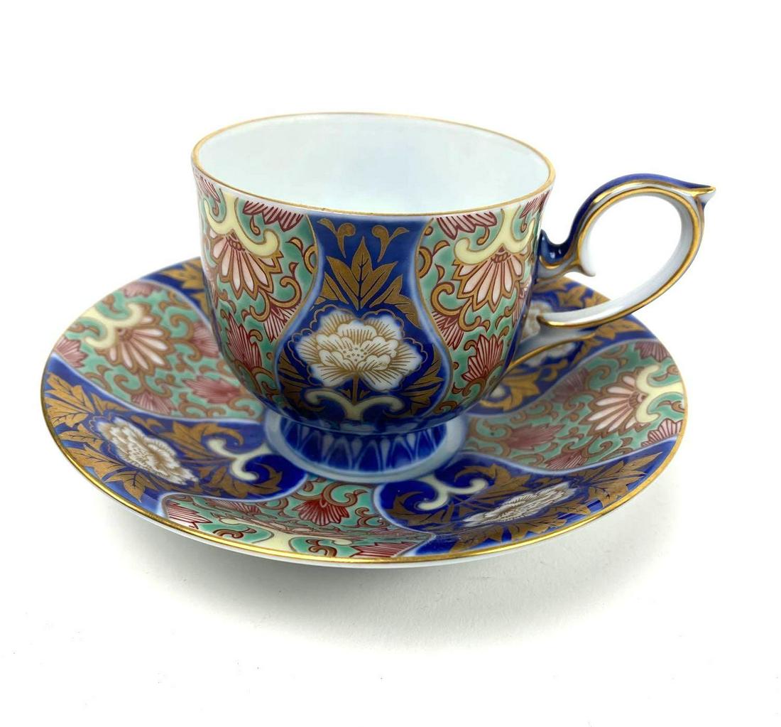 Fukagawa Japanese Tea Cup and Saucer: Porcelain, Fukagawa (Mt. Fuji mark) Japanese floral tea cup with matching saucer. Cup: 2.5in. Saucer: 5in diameter.