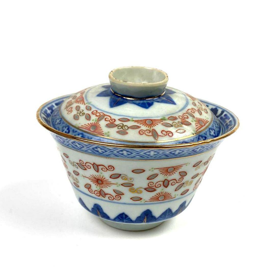 Japanese Lidden Tea Cup: Japanese lidded tea bowl with dragon pattern in bottom of cup and lid. 2.5in high; 4in diameter.
