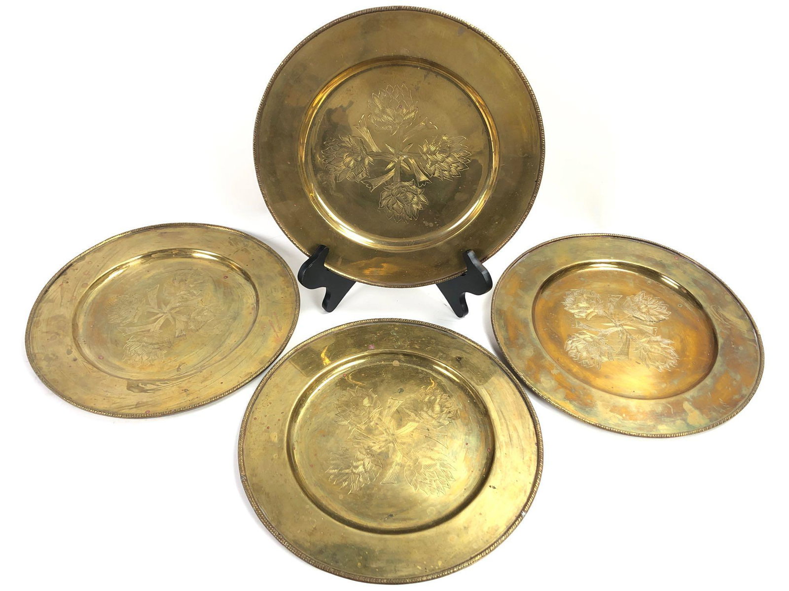 4 Mottahedeh Brass Platters: 4 identical platters, made in India. Each measures 12 inches wide.