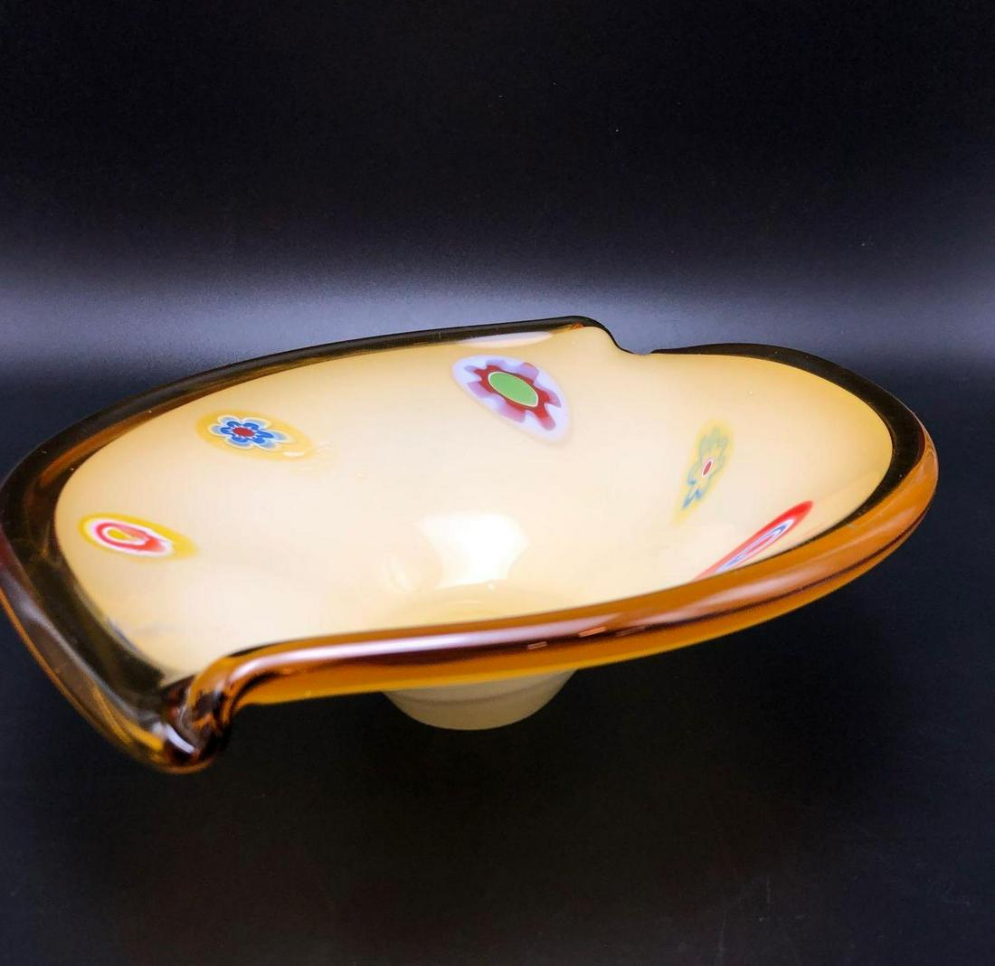 Yellow Murano Glass Bowl: Murano style glass bowl features millefiori throughout interior. Measures 13 inches long 10 1/2 inches wide and 3.75 inches tall.
