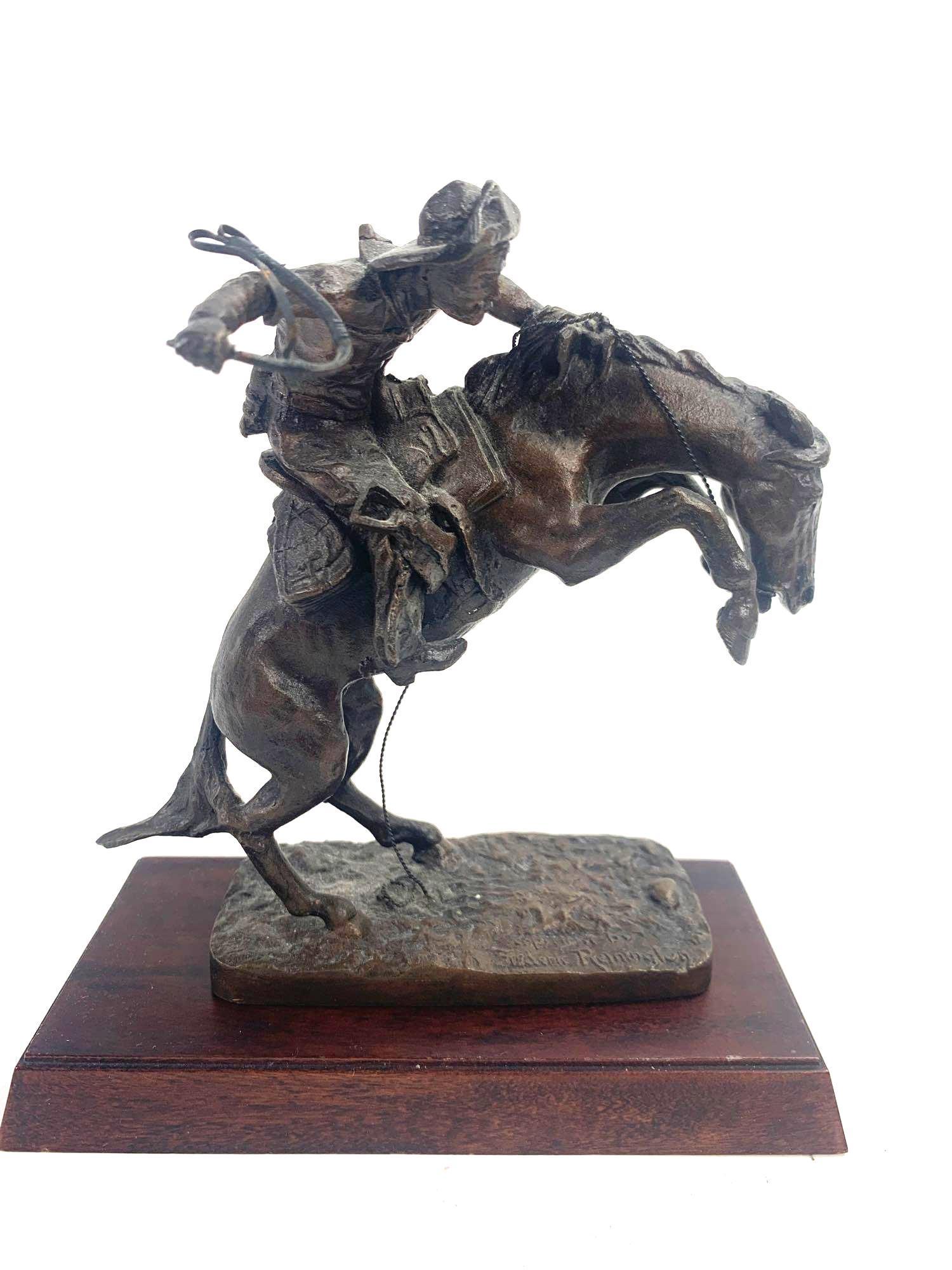 Fredrick Remington Sculpture: Sculpture replica of Remington's The Broncho Buster. Piece was minted in 1988 by the Franklin Mint. Piece is official issue of the Fredrick Remington Museum. Piece is of a cowboy and a horse. Piece co