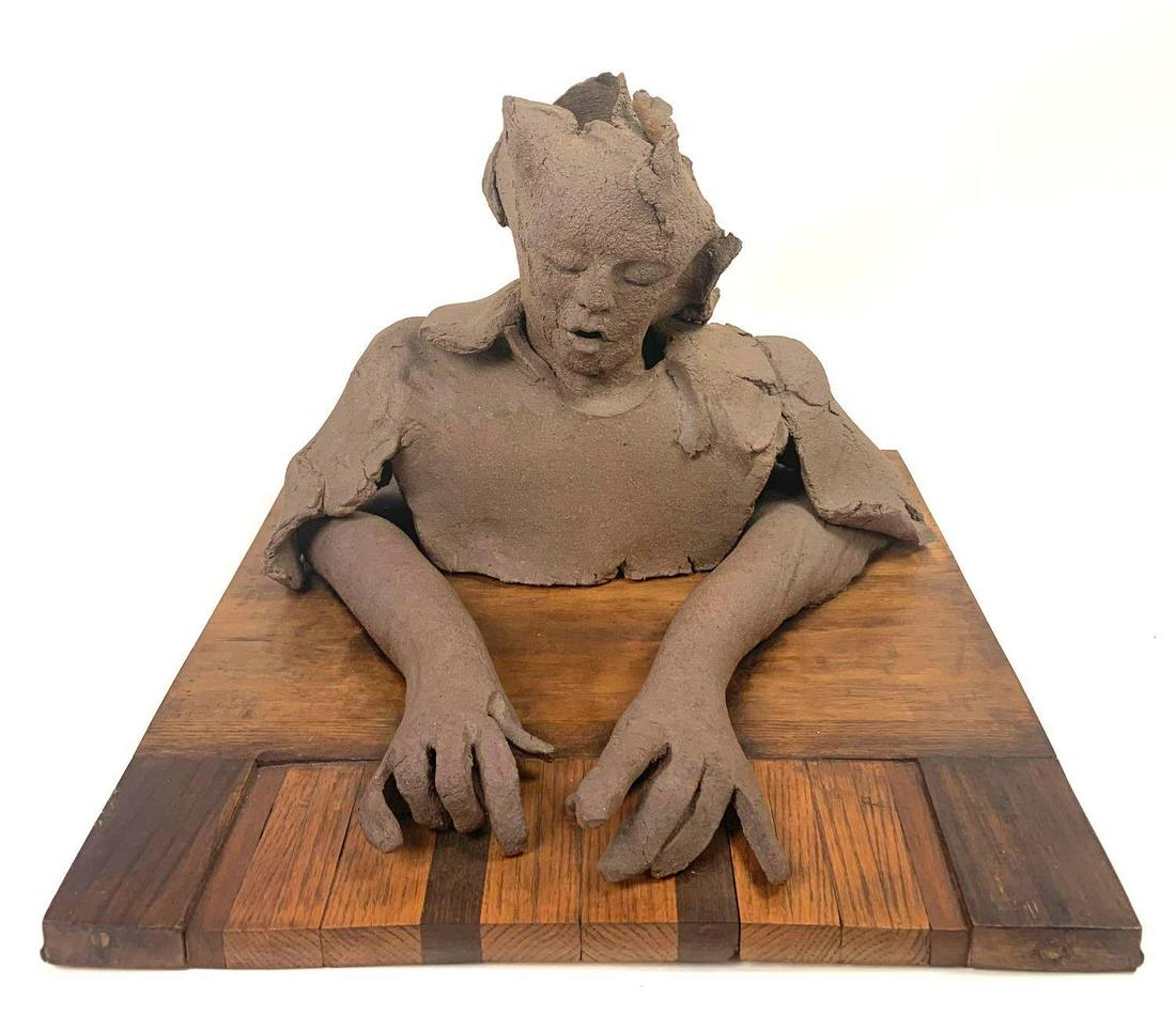 Marley, Untitled Ceramic Figure and Piano: Marley, Untitled Ceramic Figure and Piano Medium: Clay and Wood Dimensions: Art: 16" X 20.5" X 20.5" Condition: Excellent/ Very Good Additional Information: Signature on the back. Clay sculpture made 