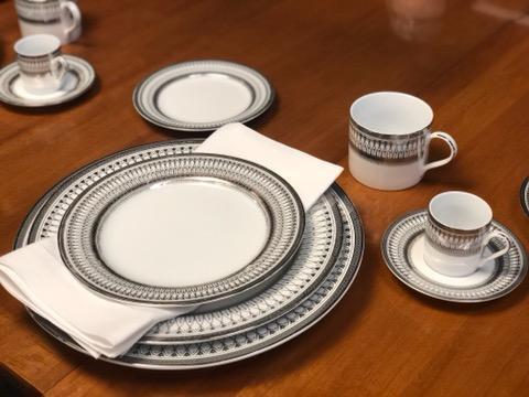 84 pc Muirfield Gothic Platinum service for 12: 84 pc Muirfield Gothic Platinum service for 12 Each set includes a dinner plate, salad plate, bread and butter plate, flat cup with handle and saucer, and a demitasse cup with handle and saucer in the