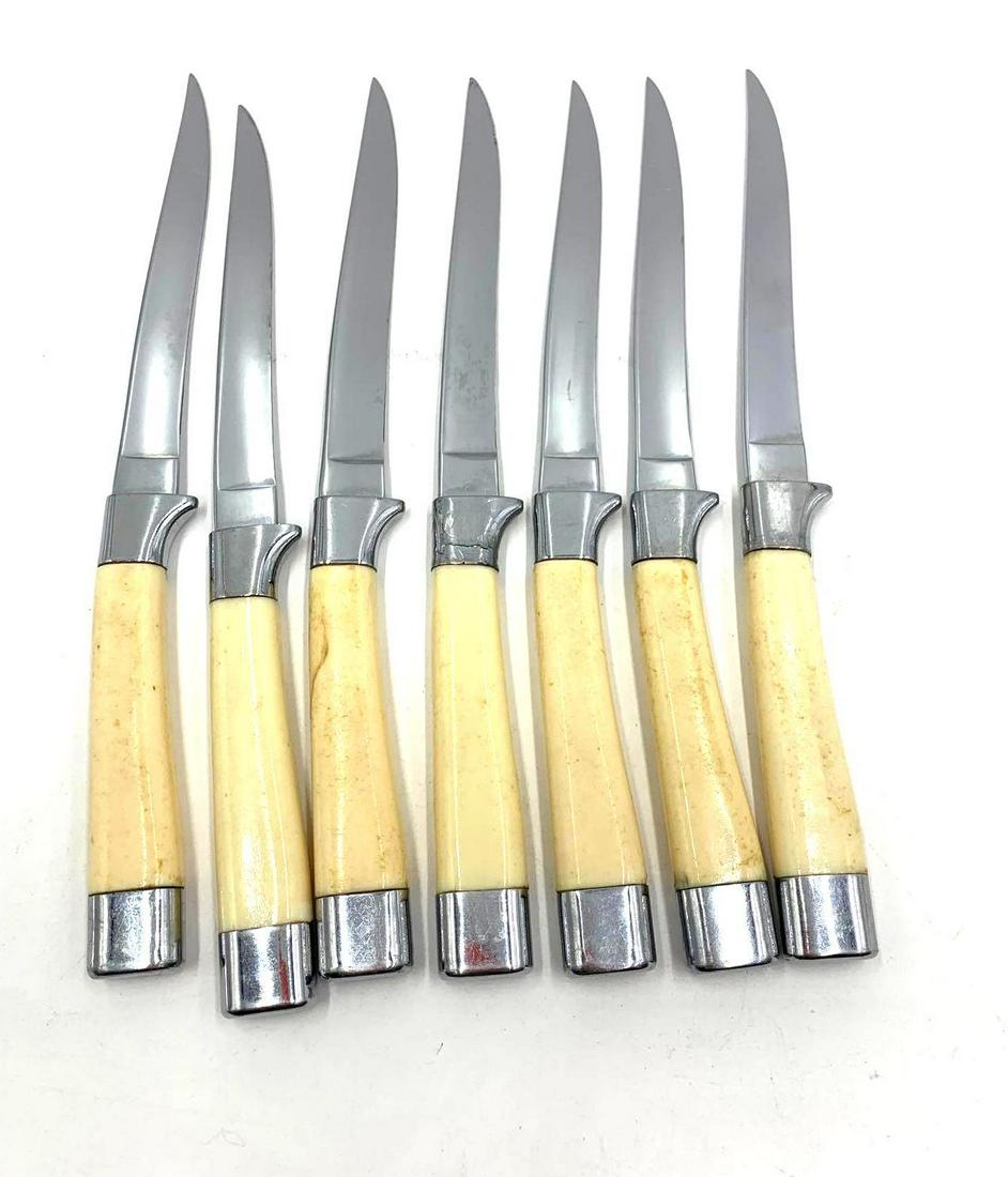 Carver Hall Steak Knives: Seven vintage Carver Hall by Briddell chrome vanadium steak knives with Bakelite handles. The knives measure 8.25 inches long.