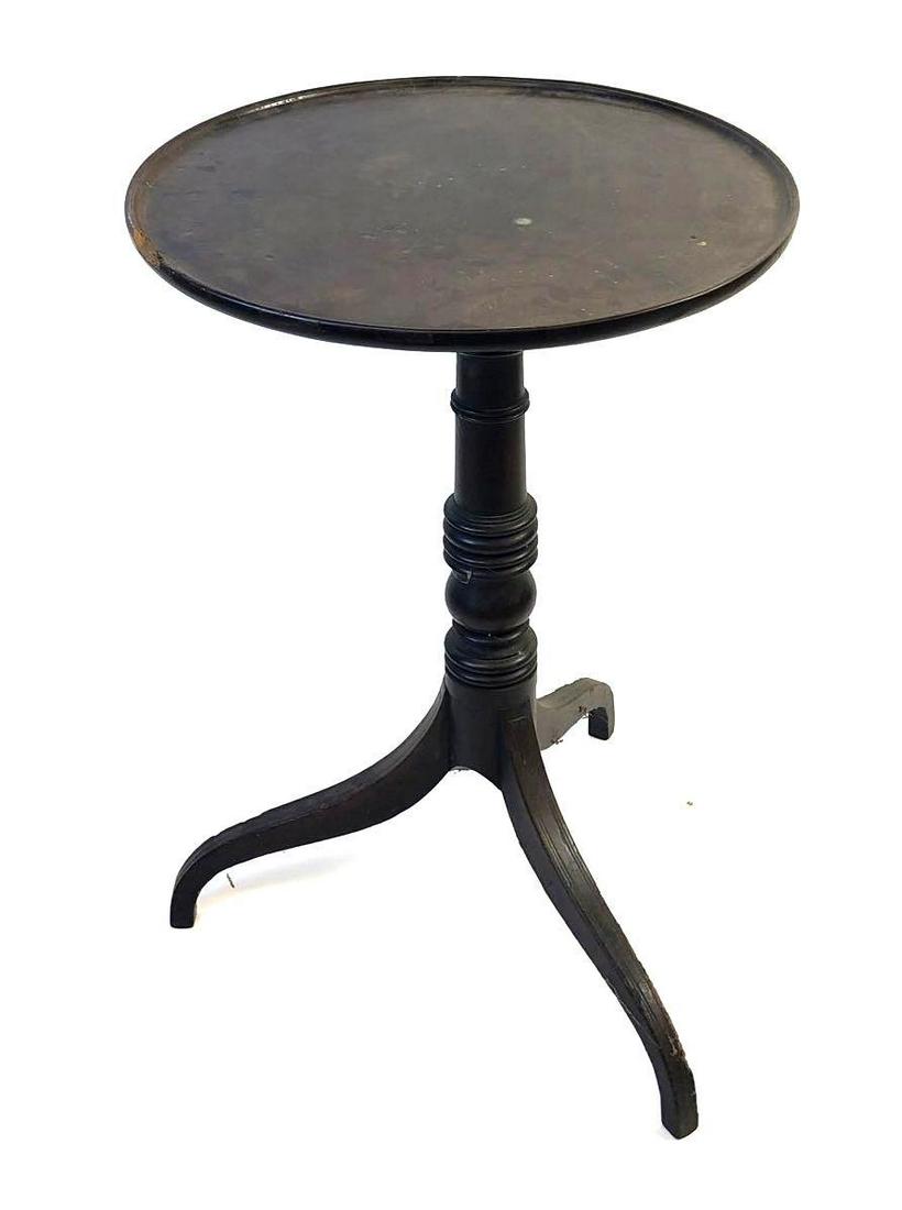 Tilt Top Table: round top table has a chip to its rim but it is made out of wood. Table top measures 20 inches in diameter and the height of the table is 28.5 inches tall. It features a tripod base and