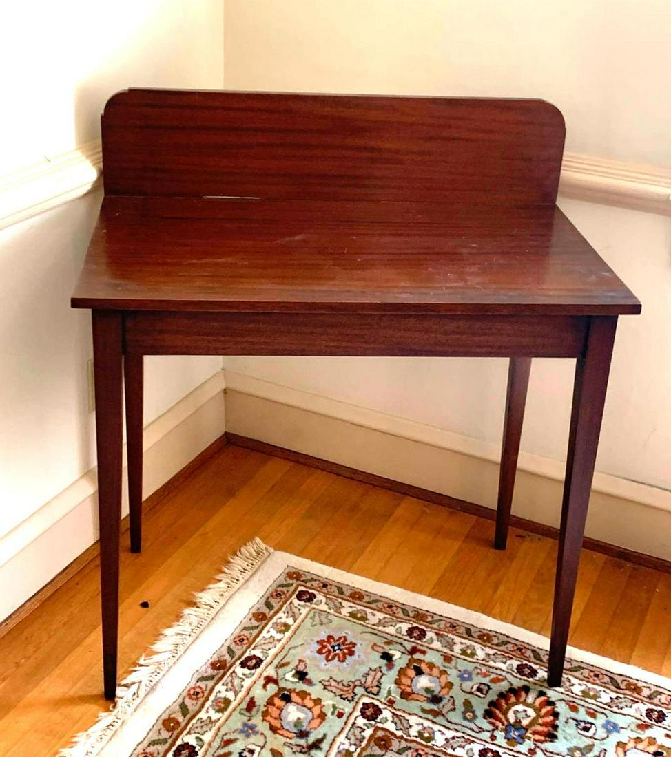 Mahogany Side Table: Mahogany side table with tapered legs. It measures 3.25 inches long by 19.75 inches deep by 37.75 inches tall. ** Notice: This lot is located, in Hampton, Virginia. It requires pickup, in Hampton - on