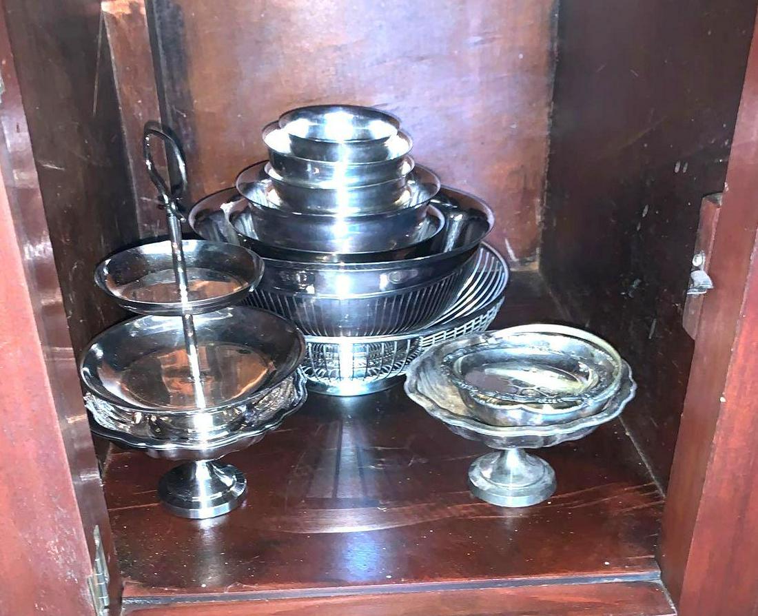 Silver-plate Bon Bon: Contents of cabinet contains silver-plate bon bon dishes and footed bowls. ** Notice: This lot is located, in Hampton, Virginia. It requires pickup, in Hampton - only on June 13th and 14th, between 10