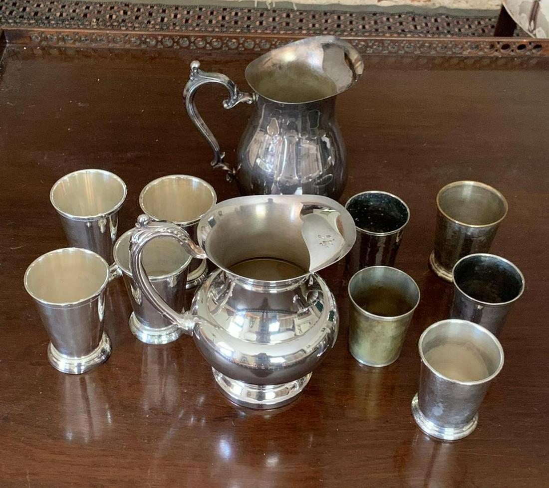Oneida Silver-plate Pitcher: Silver-plate and electric plate items to include an Oneida pitcher and Towle footed cups. There are two pitchers and a total of nine cups. ** Notice: This lot is located, in Hampton, Virginia. It requ