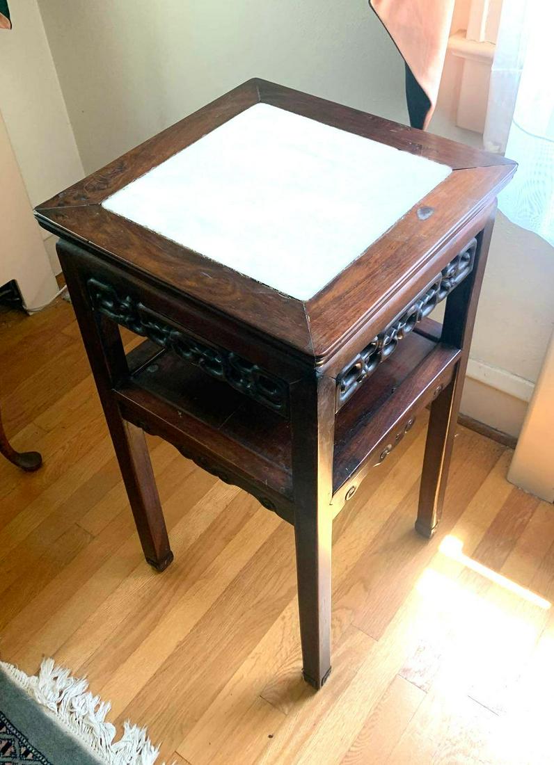 Marble Top Table: Marble top Asian style table with a shelf. The table measures 16.25 inches long by 16.5 inches deep by 31.5 inches tall. ** Notice: This lot is located, in Hampton, Virginia. It requires pickup, in Ha