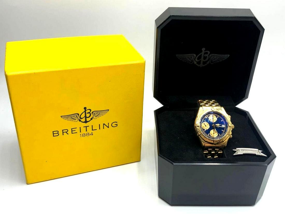 Authentic Breitling 18k Yellow Gold Watch: Breitling model K13050 18k yellow gold watch with a black and gold dial. Approximately manufactured in the year 2000. Watch comes in a 40mm Yellow Gold Case with Yellow Gold bezel, Blue dial and Yello