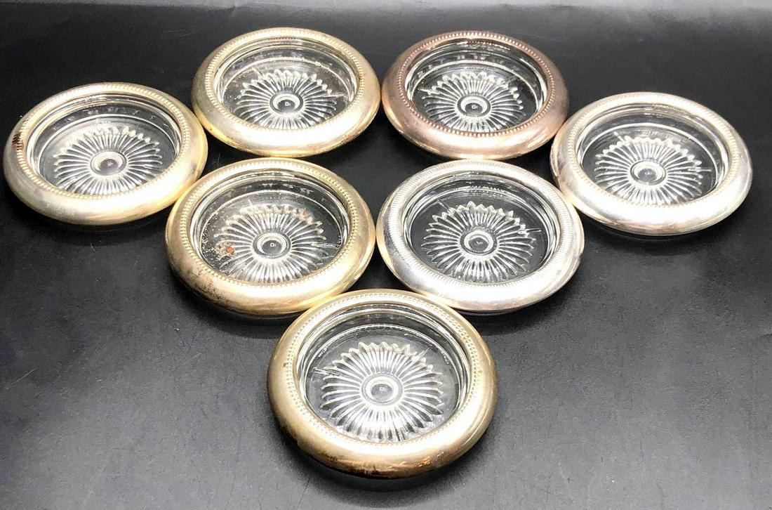 Sterling Silver and Glass Coasters: Sterling silver and glass coasters are stamped sterling around the rim as well as STC, each coaster measures 4 inches wide and .75 inches tall.
