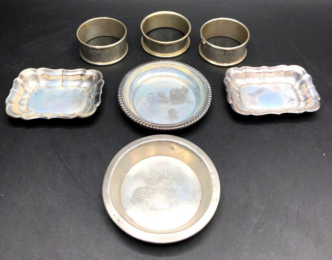 Sterling Silver Trays and Napkin Rings: Reed and Barton sterling silver trays measure 3 inches long and 2 inches wide. Sterling silver tray with ribbed rim measures 3 inches in diameter. Sterling silver dish reads July 4, 1933 harlequin rac