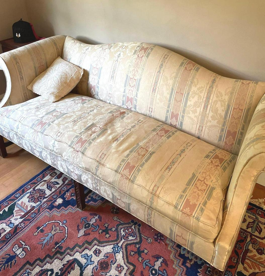 Long Couch/Loveseat by Southwood: Long couch with carved wooden legs, a striped pattern, and a pillow. Couch measures 73 inches long, 32 inches wide, and 33 inches tall. ** Notice: This lot is located, in Hampton, Virginia. It require