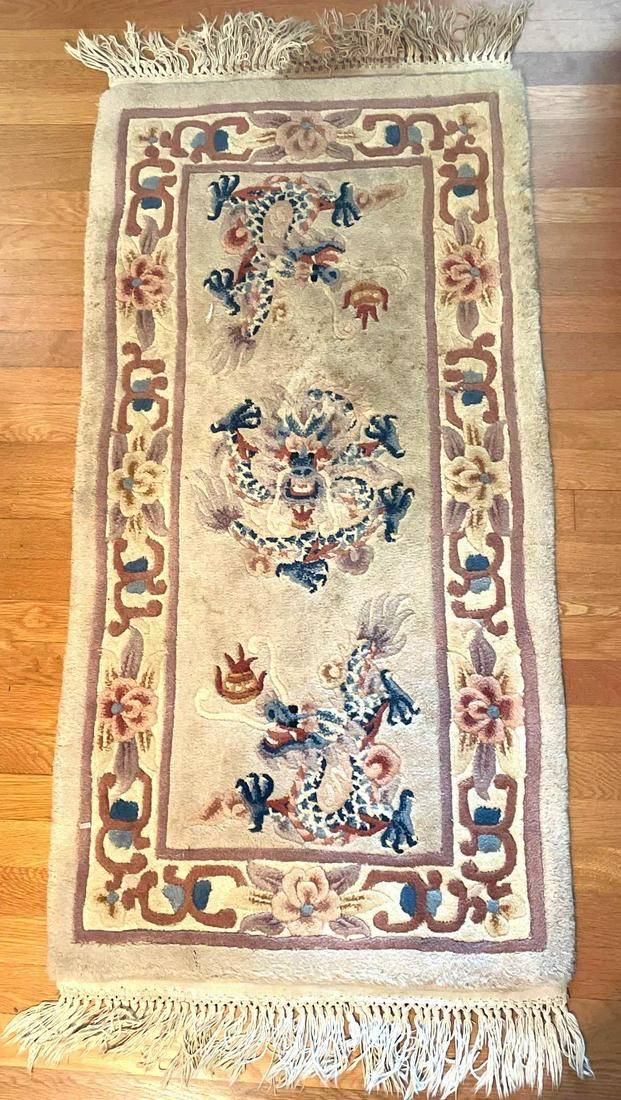 Pair of Runners: A pair of runner rugs which feature dragon imagery and fringe. Runners are 51 inches long and 25.5 inches wide. ** Notice: This lot is located, in Hampton, Virginia. It requires pickup, in Hampton - o