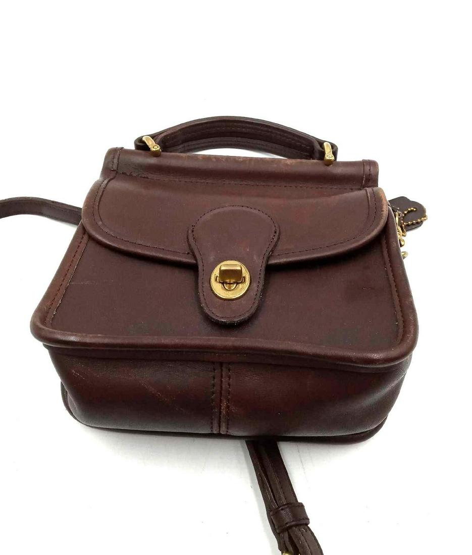 Brown Coach Cross Body Purse: Brown Coach Cross Body Purse with shoulder strap. Dimensions 7 inches in length, 7 inches in width