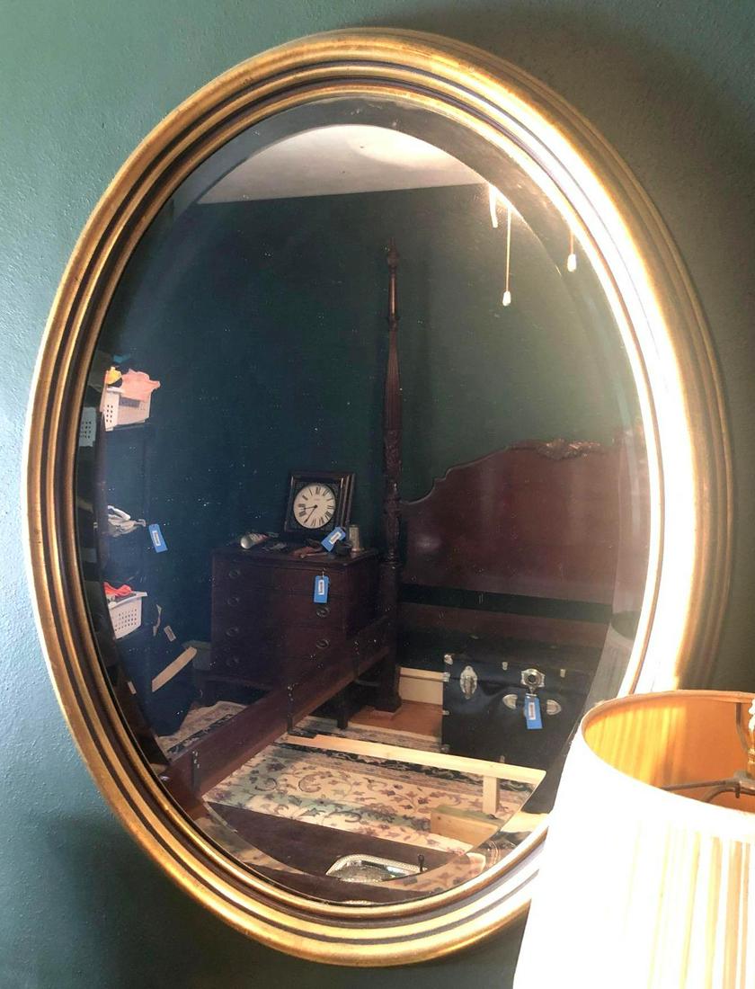 Large Oval Mirror: large oval mirror has a beveled edge and measures 31 inches tall and 25 inches wide. ** Notice: This lot is located, in Hampton, Virginia. It requires pickup, in Hampton - only on June 13th and 14th,