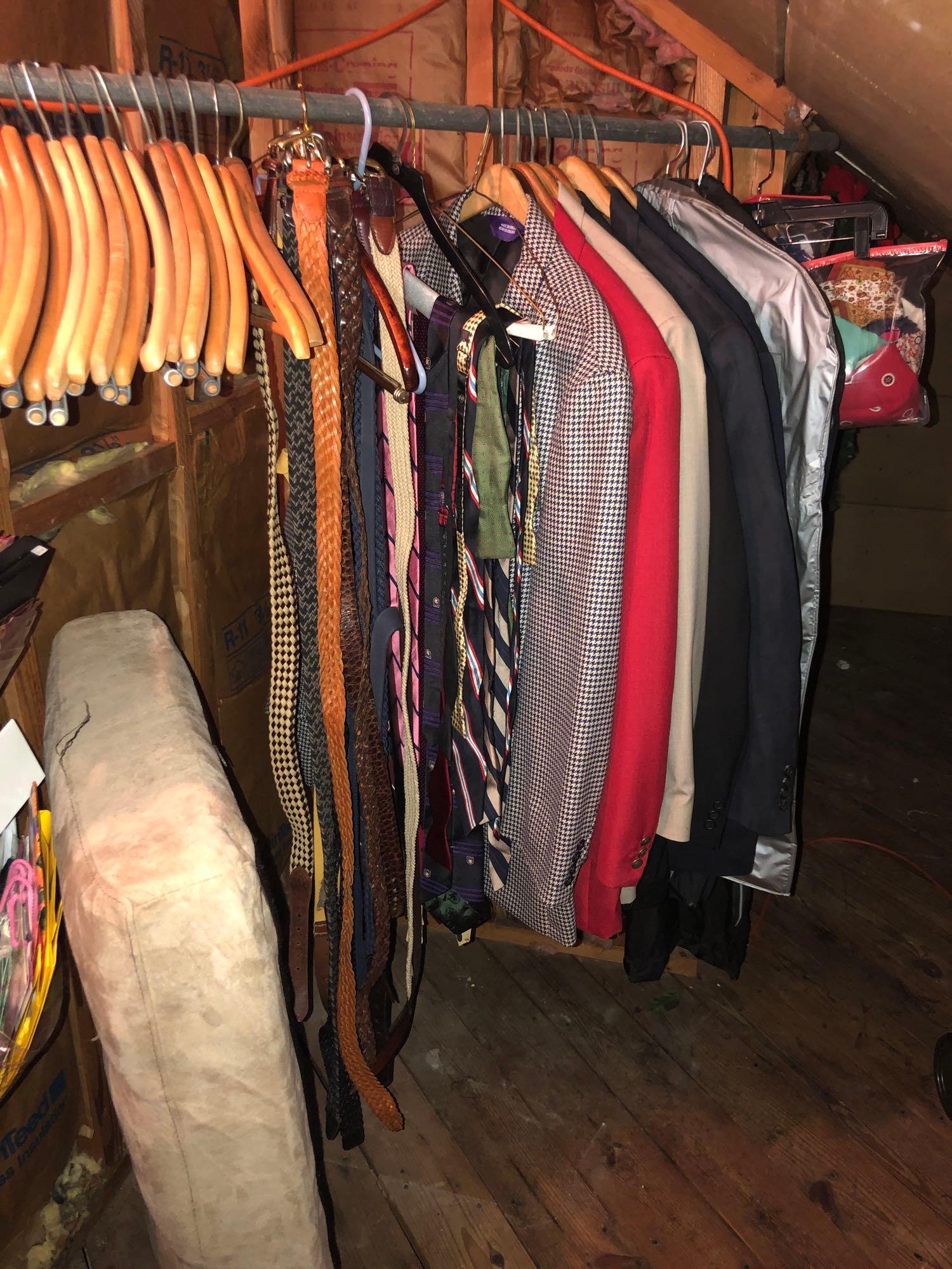 Mens Clothes on Hanging Rack: Men's clothes size L-XXXL include belts ties and men's full suits of various materials. Lot also includes wooden hangers and a hanging storage bag. ** Notice: This lot is located, in Hampton, Virginia