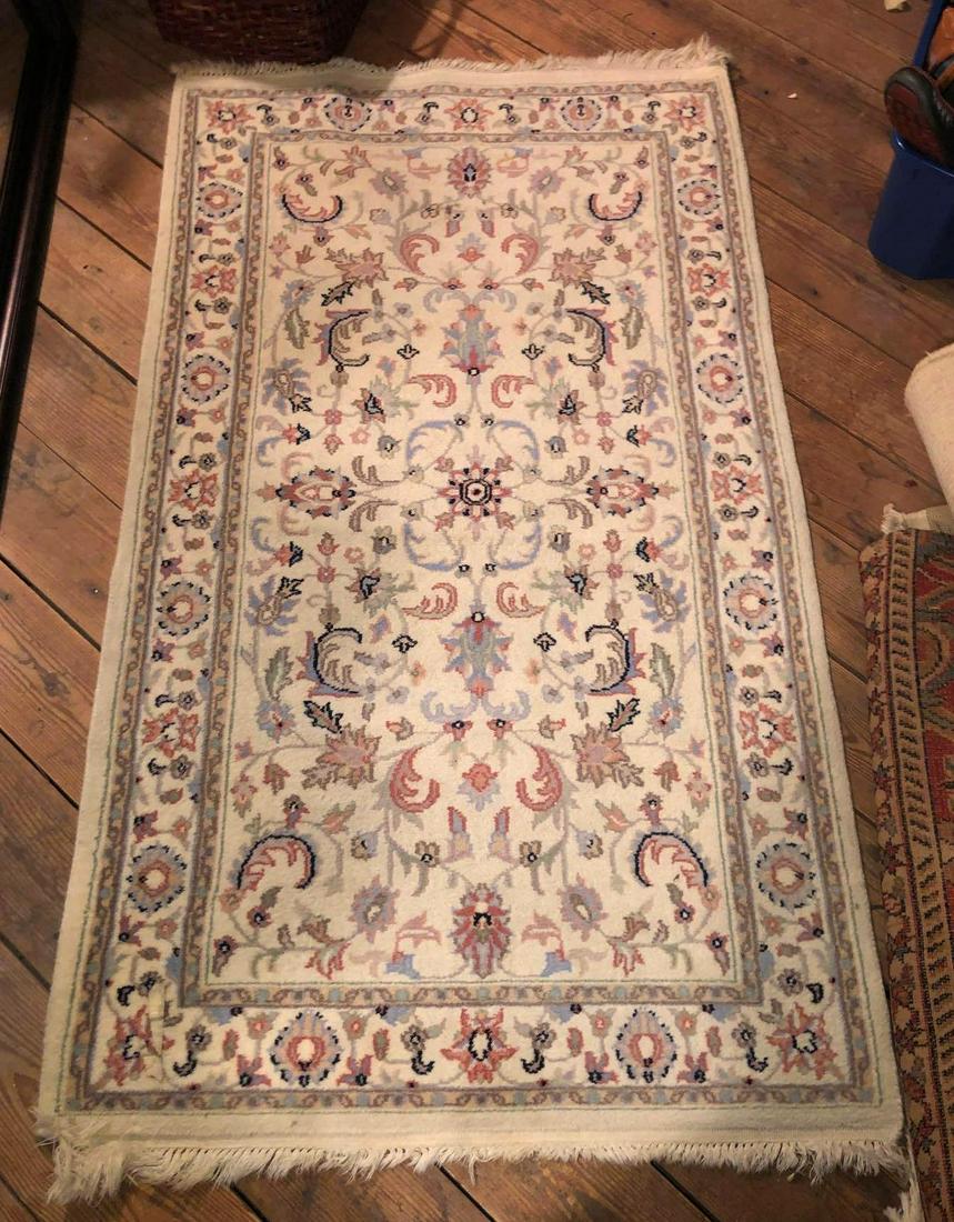 Floral Area Rug: Area rug with pinks greens and blues and a beige base color Measures 34 inches wide and 62 inches long. ** Notice: This lot is located, in Hampton, Virginia. It requires pickup, in Hampton - only on J