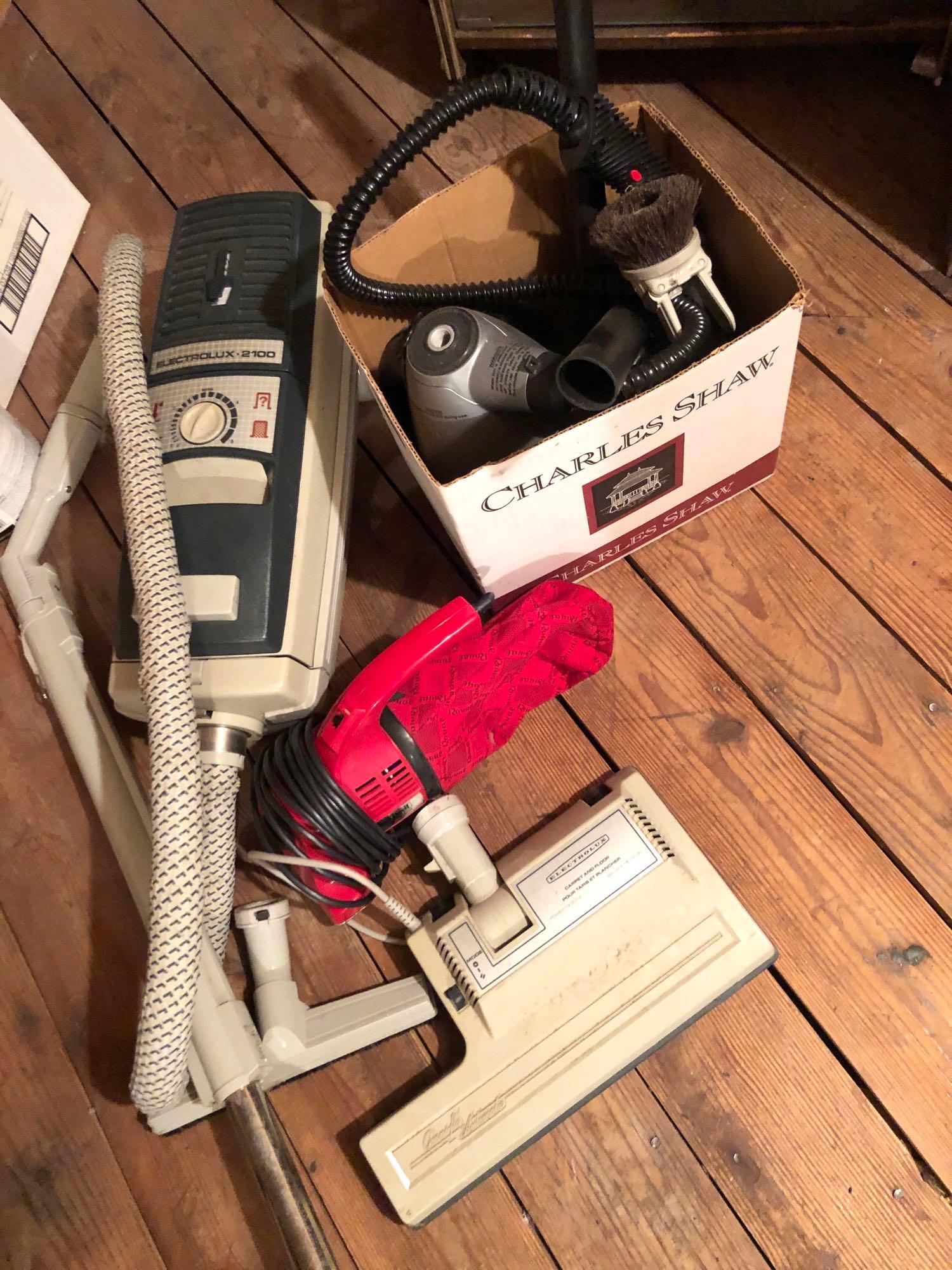 Vacuum Cleaners and Accessories: Lot includes a dirt devil, an Electrolux 2100 and a Shark portable steam cleaner as well as attachments and accessories. ** Notice: This lot is located, in Hampton, Virginia. It requires pickup, in Ha