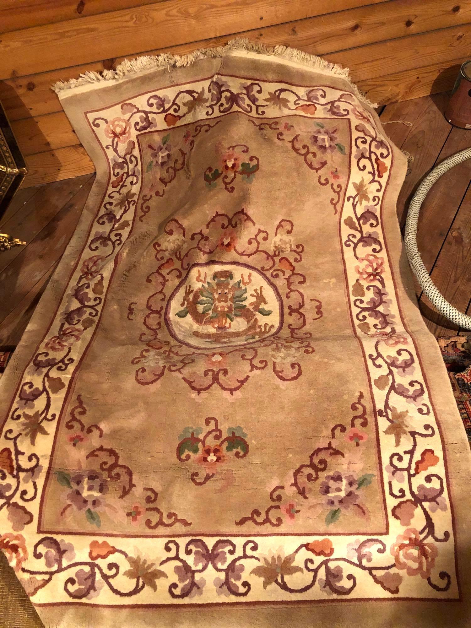 Large Area Rug: large area rug with pink, purple, white, and beige tones measures approximately 47 inches wide and 6.5 ft long. ** Notice: This lot is located, in Hampton, Virginia. It requires pickup, in Hampton - o
