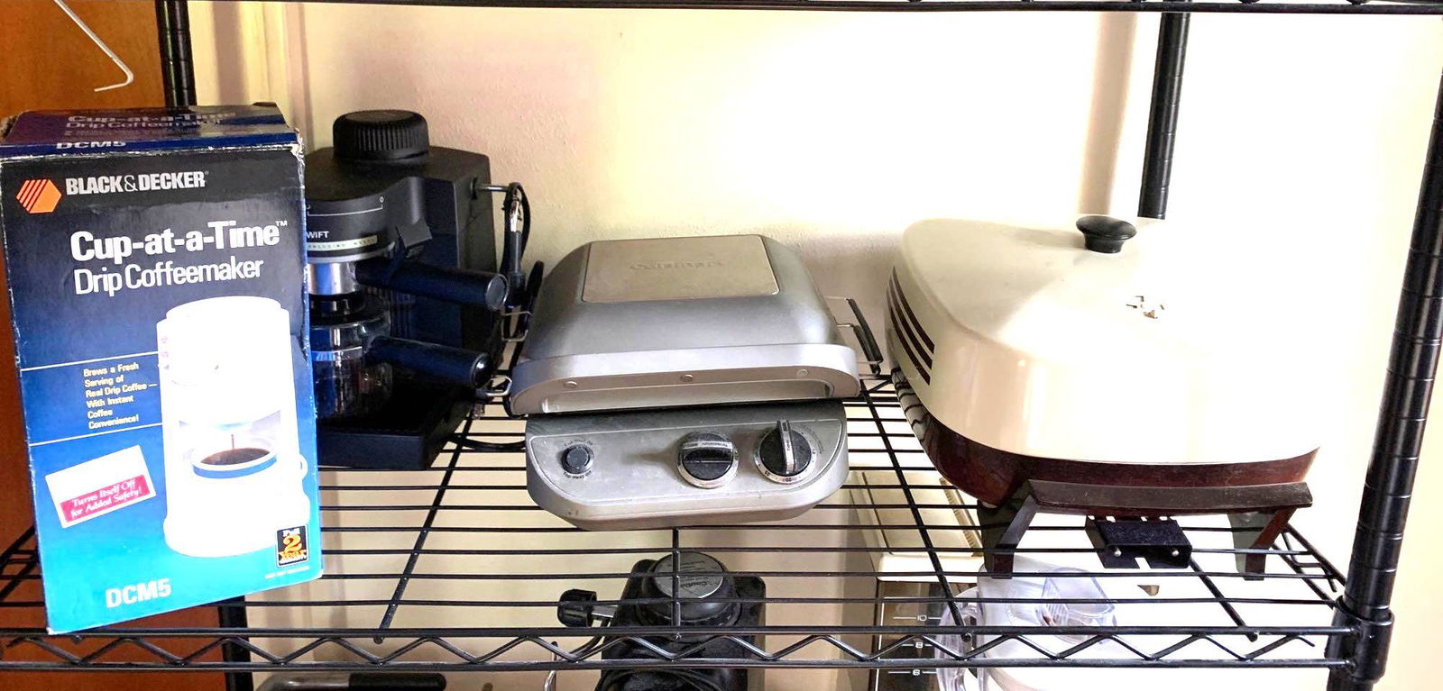 Cuisinart Black & Decker: Third shelf of metal stand consists of a Black & Decker Cup at a time coffee maker, Cuisinart Grill, electric skillet, and Swift espresso machine. ** Notice: This lot is located, in Hampton, Virginia.