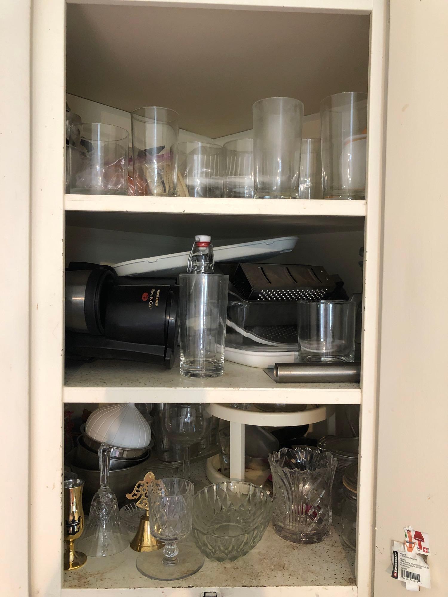 Contenta of Cabinet: large lot includes various glassware and crystal- as well as kitchen items cups cheese graters and more. ** Notice: This lot is located, in Hampton, Virginia. It requires pickup, in Hampton - only on