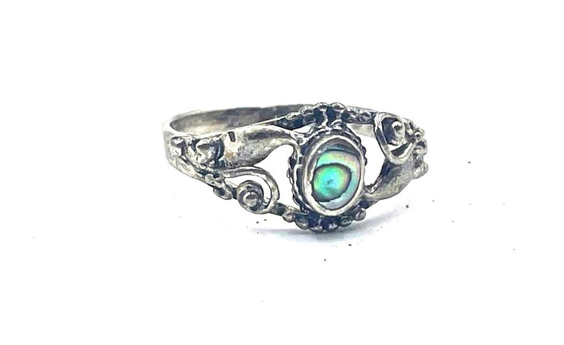 Sterling Silver Abalone Ring: Sterling Silver ring, featuring a central abalone stone and a floral motif along the ring head. Ring is a size 7 and weighs 0.06ozt.