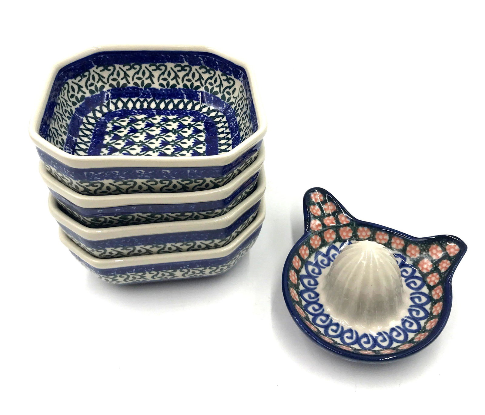 Four Small Ramekin Polish Bowls and a Lemon Juicer: Four Small Ramekin Polish Pottery Bowls and a Lemon Juicer. The four ramekin dishes have a slightly square shape with deep blue and green designs. The bottom of the dishes has 'Hand made in Poland' on