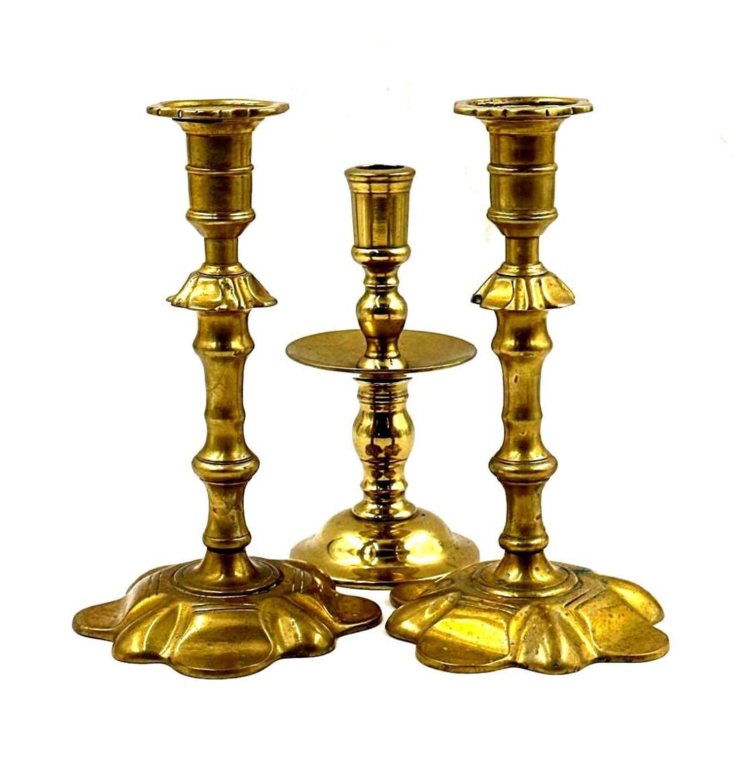 Pair of Queen Anne and Mid Drip Brass Candlesticks: Pair of Queen Anne and Mid Drip Brass Candlesticks. The pair of Queen Anne Push-Up candlesticks with lobed bases that have been modified with a push-up. Each measures 9 inches tall. The mid-drip candl