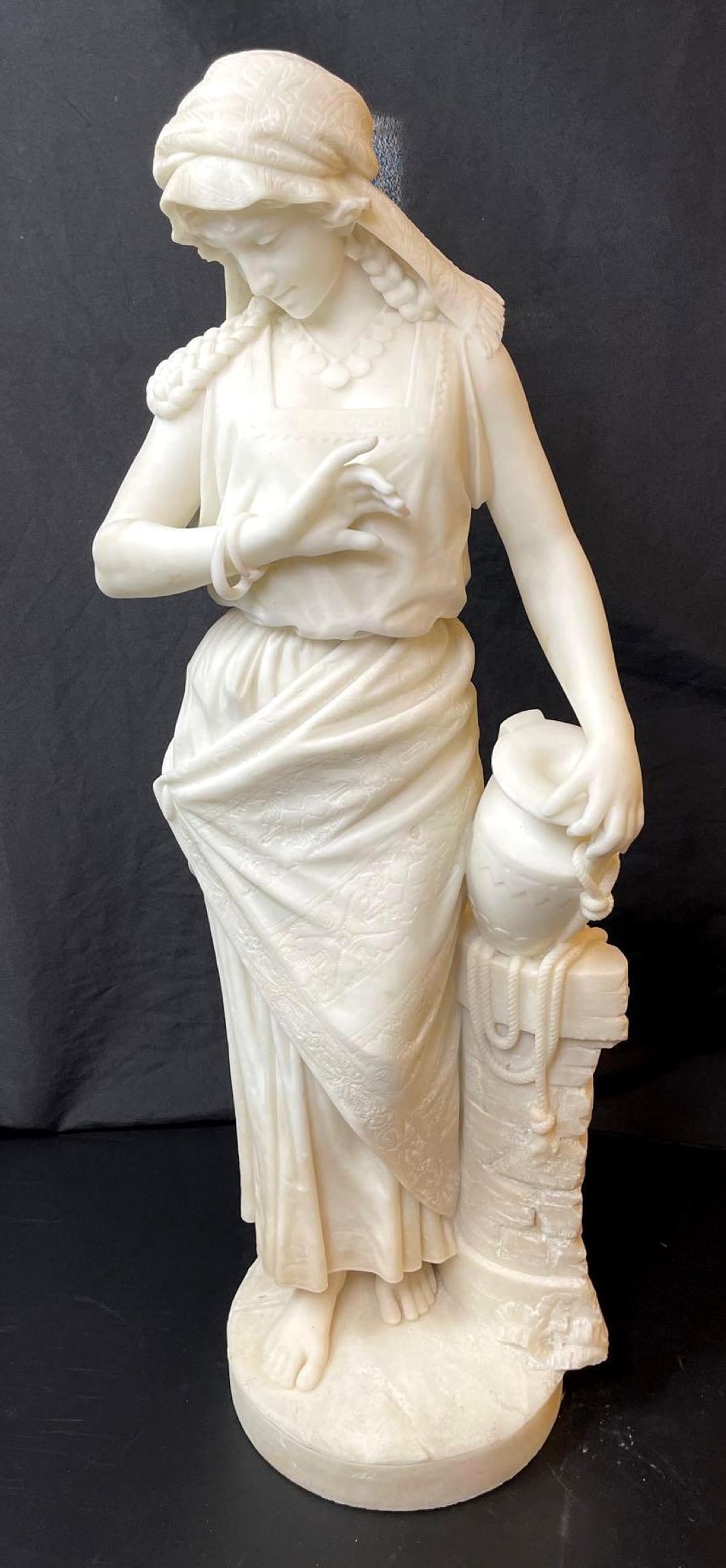 Italian Marble Statue of Rebecca at the Well: Italian Marble Statue of Rebecca at the Well. From Northern Italy in mint condition. Circa 1880. There is no maker's mark on the bottom. The statue measures 10 3/4 x 9 x 35 3/4 inches.