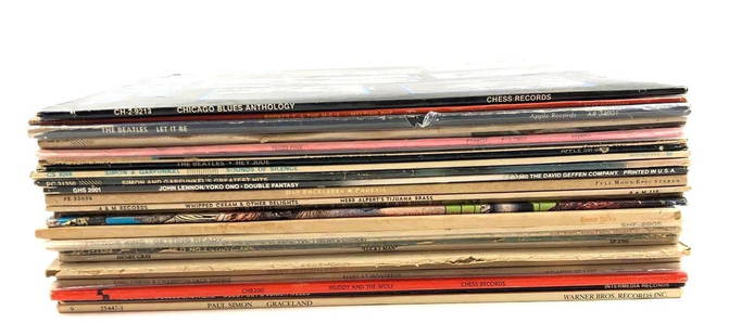 Collection of 25 Vinyl Records: Collection of 25 Vinyl Records, this set comes with 25 albums from various artists such as The Animals, John Lennon, Simon and Garfunkel, Let it Be, Freddie King, and more. Each record is in good cond