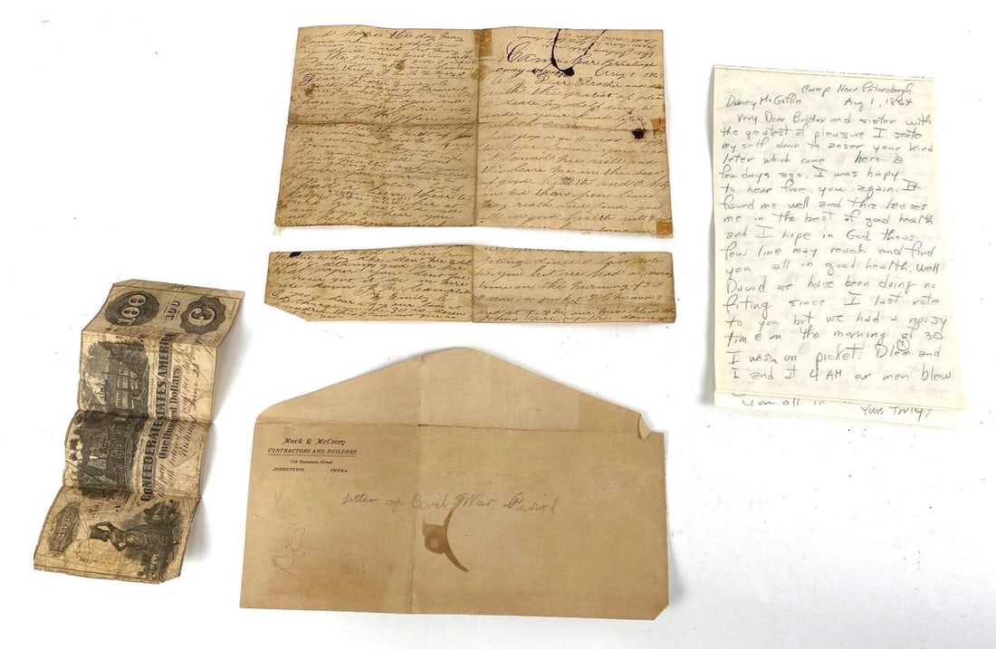 Assortment of Civil War Period Documents: Assortment of Civil War Period Documents. There are 4 documents and an envelope including a Confederate States of America One Hundred Dollar bill, a ripped document, a translation of the original hand