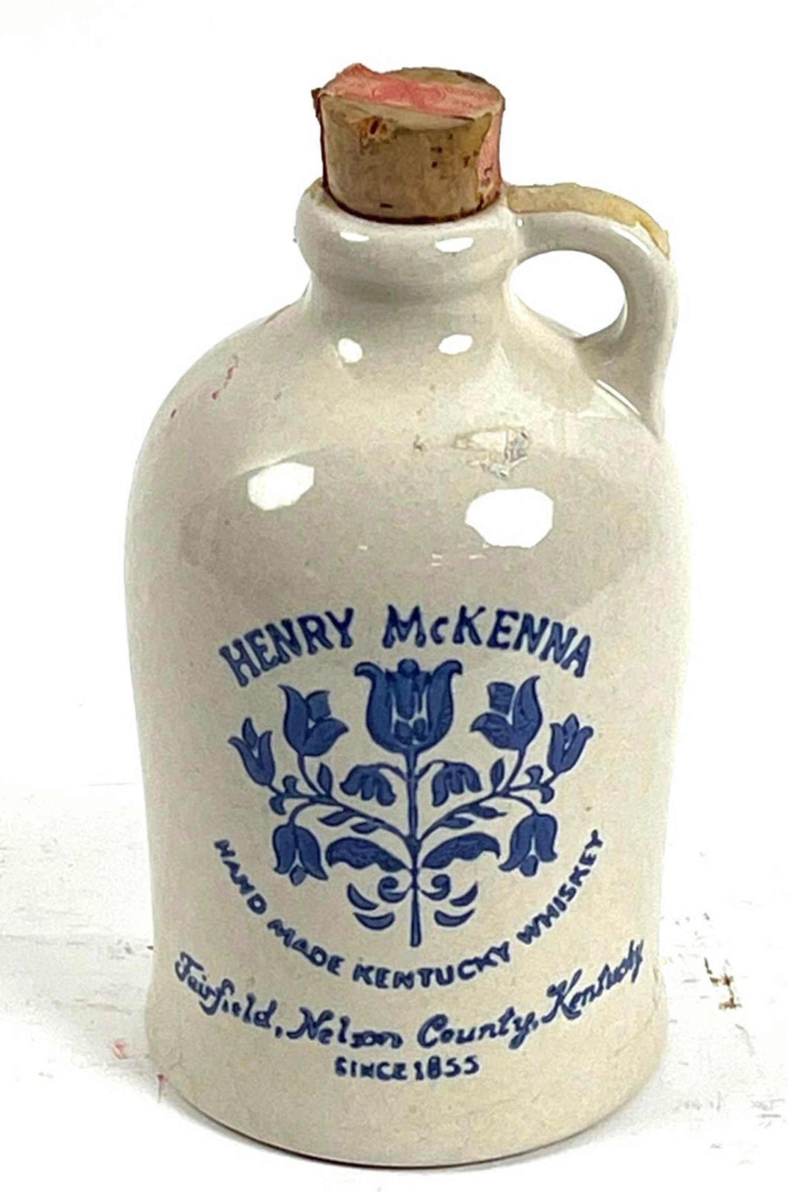 Henry McKenna Kentucky Whiskey Quart Crock: Henry McKenna Kentucky Whiskey Quart Crock.? The crock has Henry McKenna Hand made Kentucky Whiskey Fairfield Nelson County Kentucky Since 1855 stamped in blue.? The back has 4/5 Quart in blue. The bo