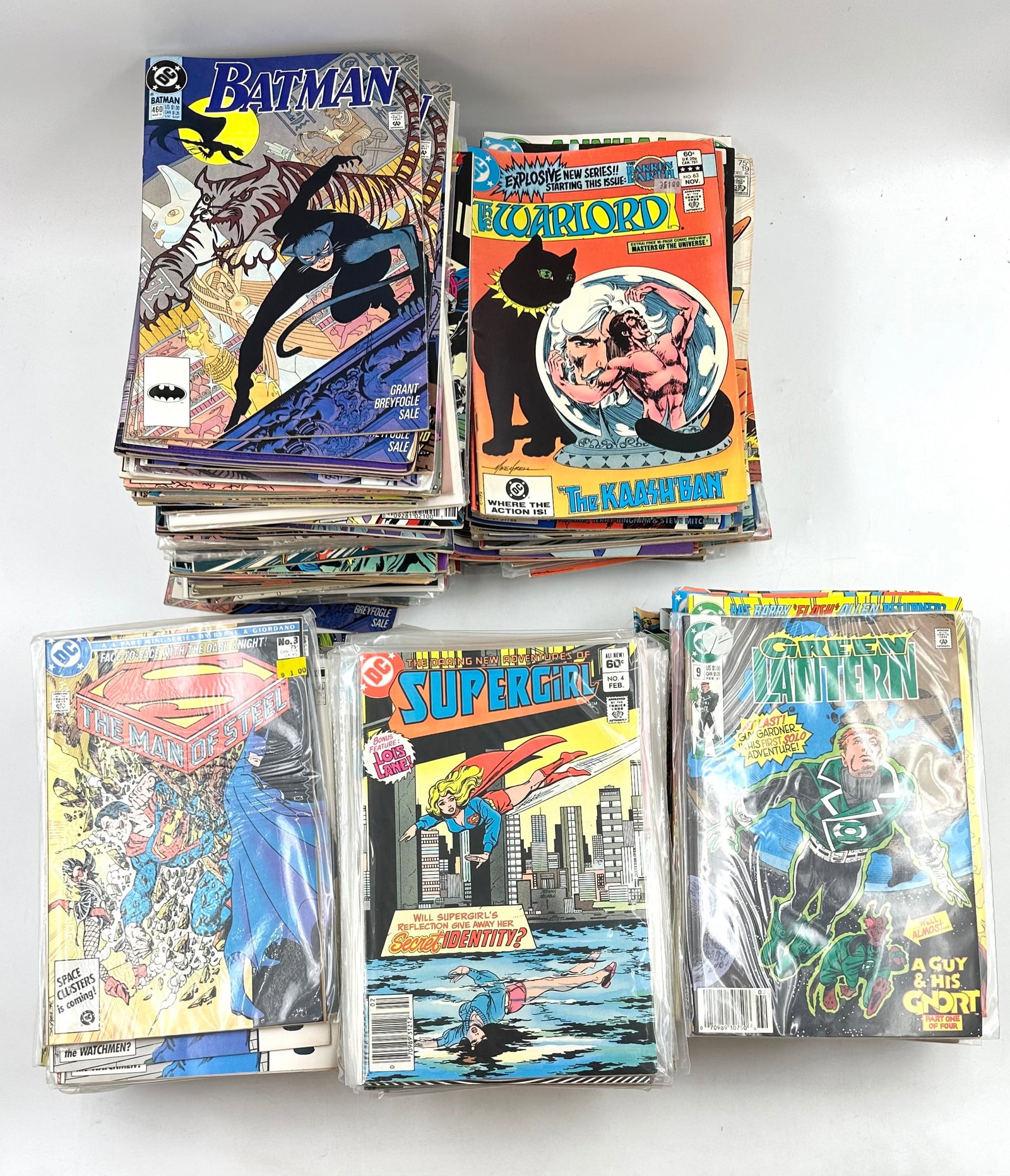 Large Assortment of Comics including Warlord Green Lantern Supergirl Batman: Large Assortment of Comics including Warlord Green Lantern Supergirl Batman And more. This large assortment includes comics of multiple editions of Green Lantern, Supergirl, Warlord, Superman The Man 