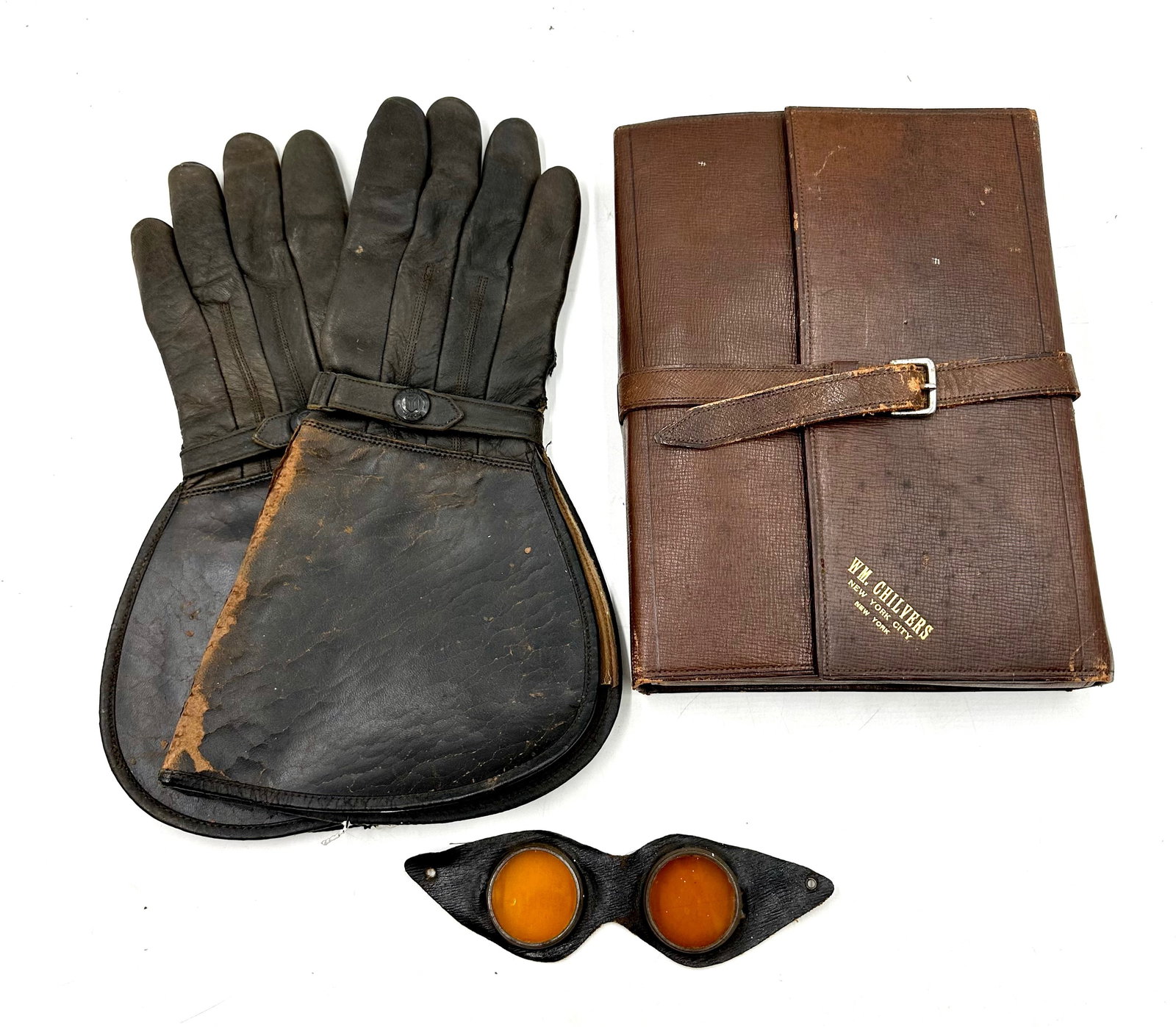 Vintage Leather Motorcycle Riding Gloves and Goggles and Leather Bottle Travel Kit: Vintage Leather Motorcycle Riding Gloves and Goggles and Leather Bottle Travel Kit. The gloves are black hide and have wear and pealing along the folds. They have a snap that reads Osborne Make as the