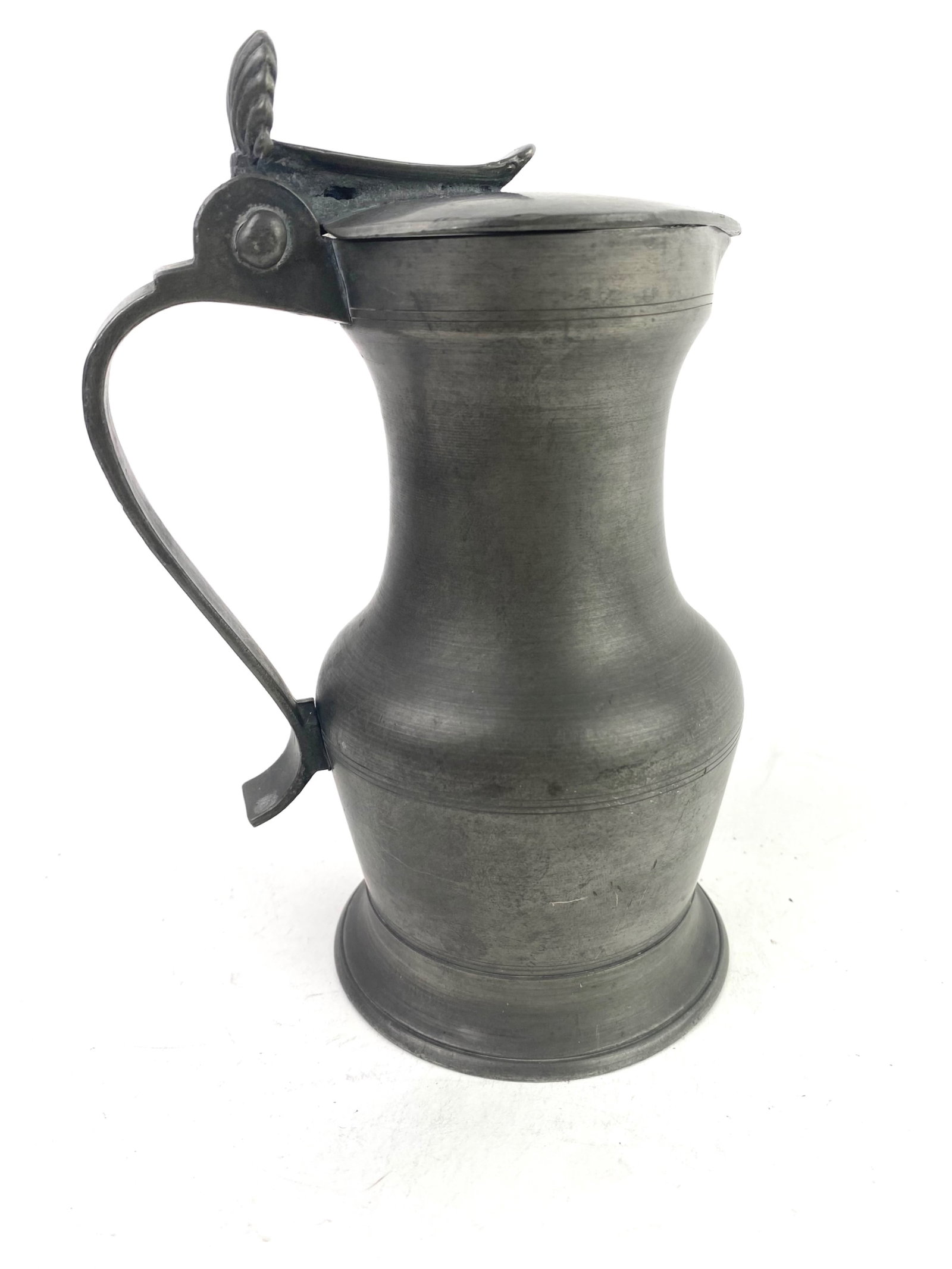 19th Century French Pewter Pitcher: 19th century French pewter pitcher with heart-shaped lid and shell thumb lift, circa 1850. The pitcher is about 5 inches in diameter and a height of 7.25 inches.