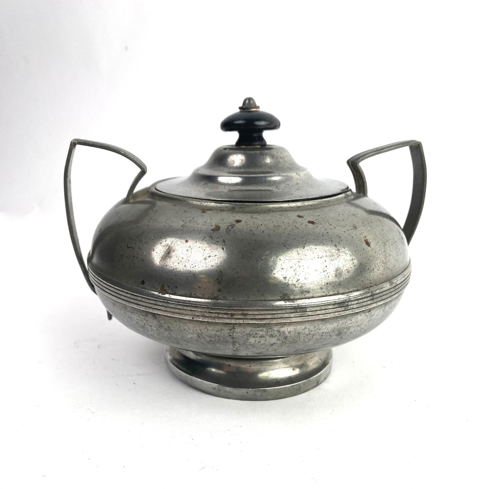 19th Century American Pewter Double Handled Sugar Bowl with Dome Lid: 19th century American pewter double handled sugar bowl with dome lid and ebony finial, circa 1825. The bowl has a diameter of about 5.5 inches and a height of 45 inches.
