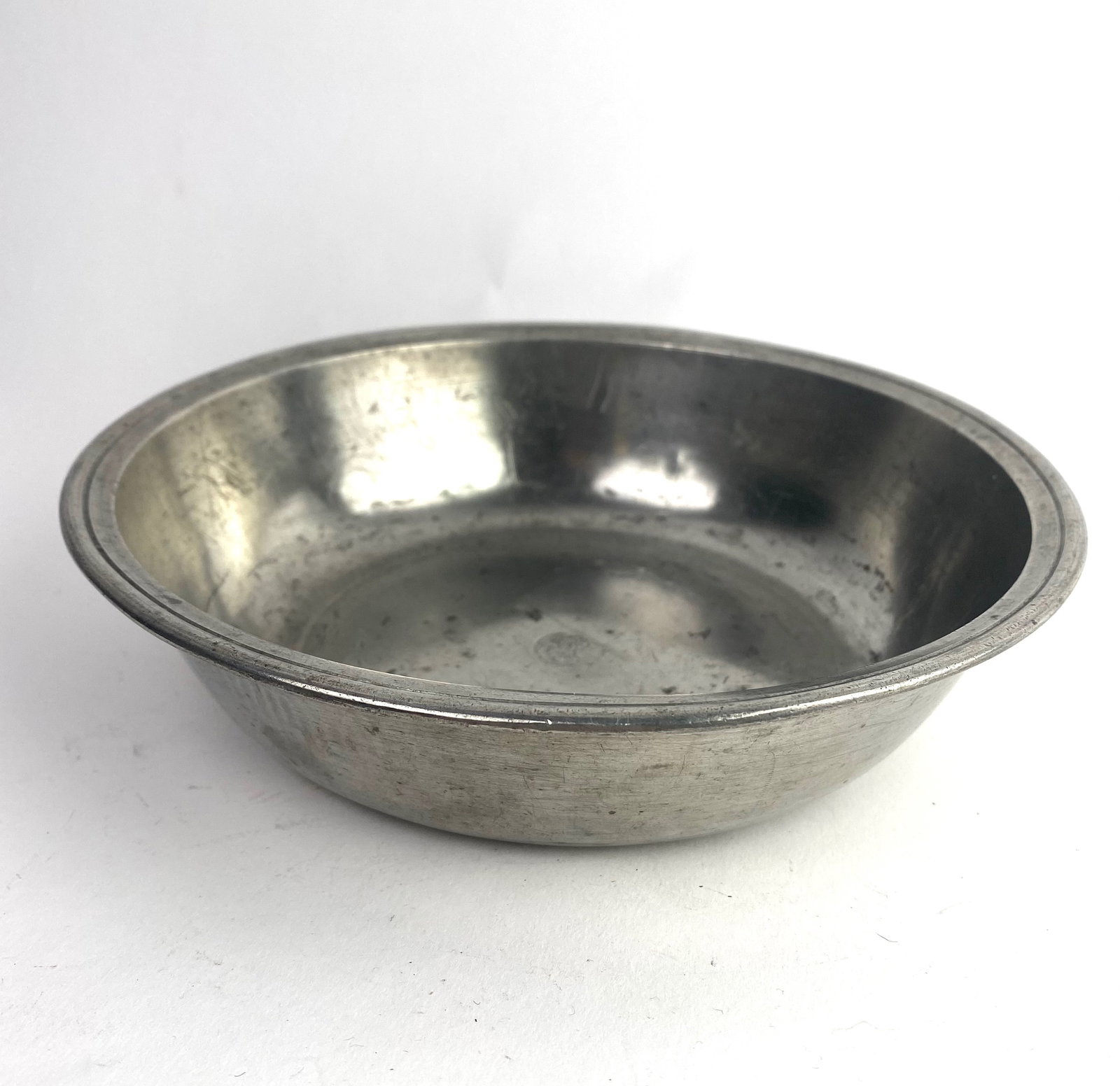 American Pewter Basin: 18th/19th century American pewter basin by: Samuel Anforth of Hartford, Conn., circa 1795-1816. The basin has a diameter of 8 inches and a height of 2 inches.
