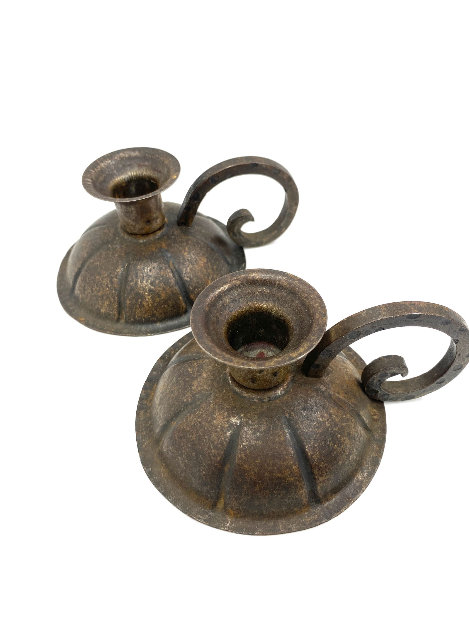 Pair of Hugo Berger Wrought-iron Candleholders: Pair of Hugo Berger Wrought-iron Candleholders: A pair of wrought-iron dome bases candlesticks by Hugo Berger, circa 1910. Markings on the bottom of both candleholders. The candleholders have a diamet