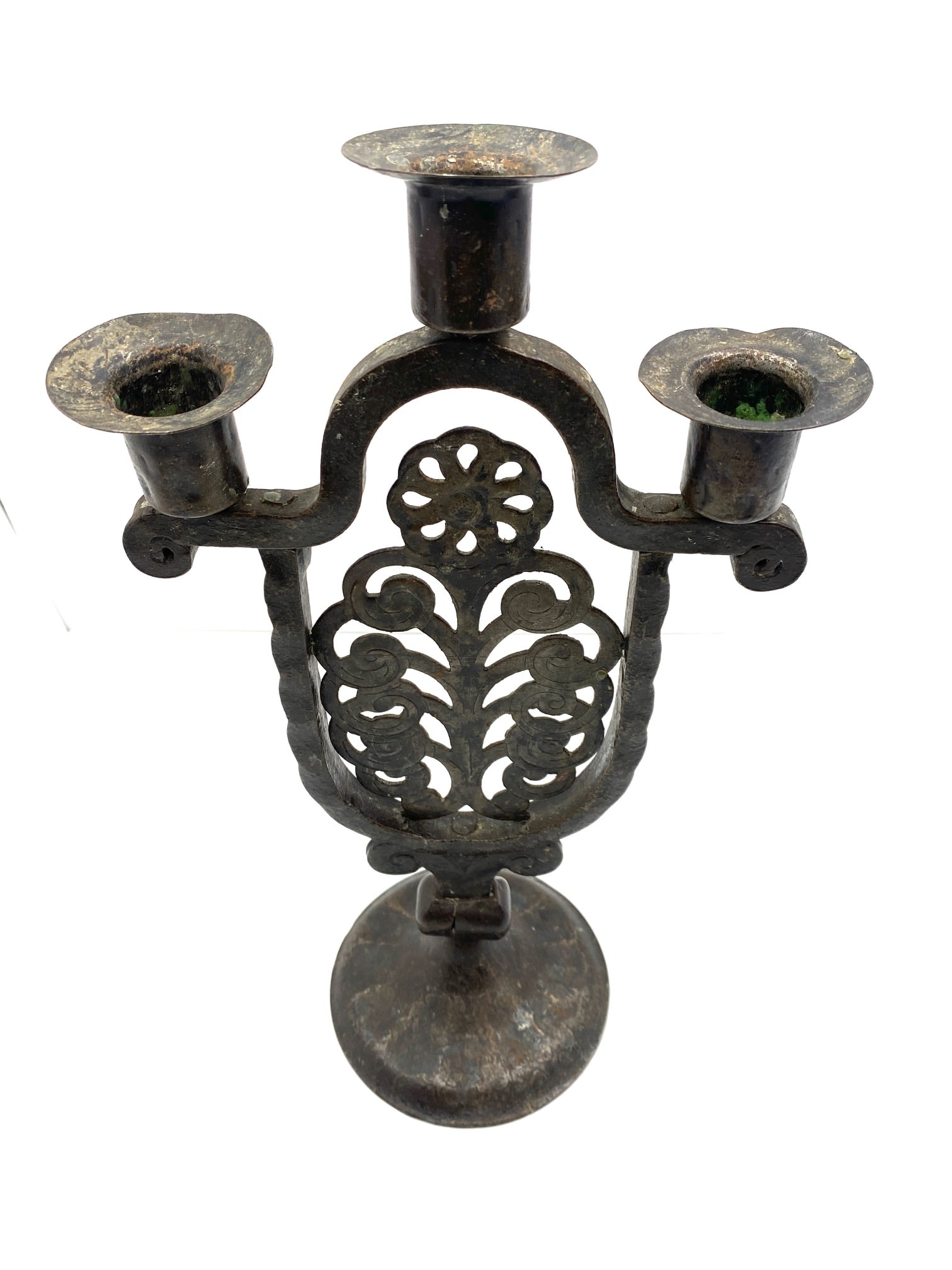 Hugo Berger Wrought-iron Candelabra: A three light wrought-iron candelabra by Hugo Berger, circa 1910. Marked "GERMANY" on the bottom. The candelabra had a diameter of about 7 inches and a height of 13.5 inches.