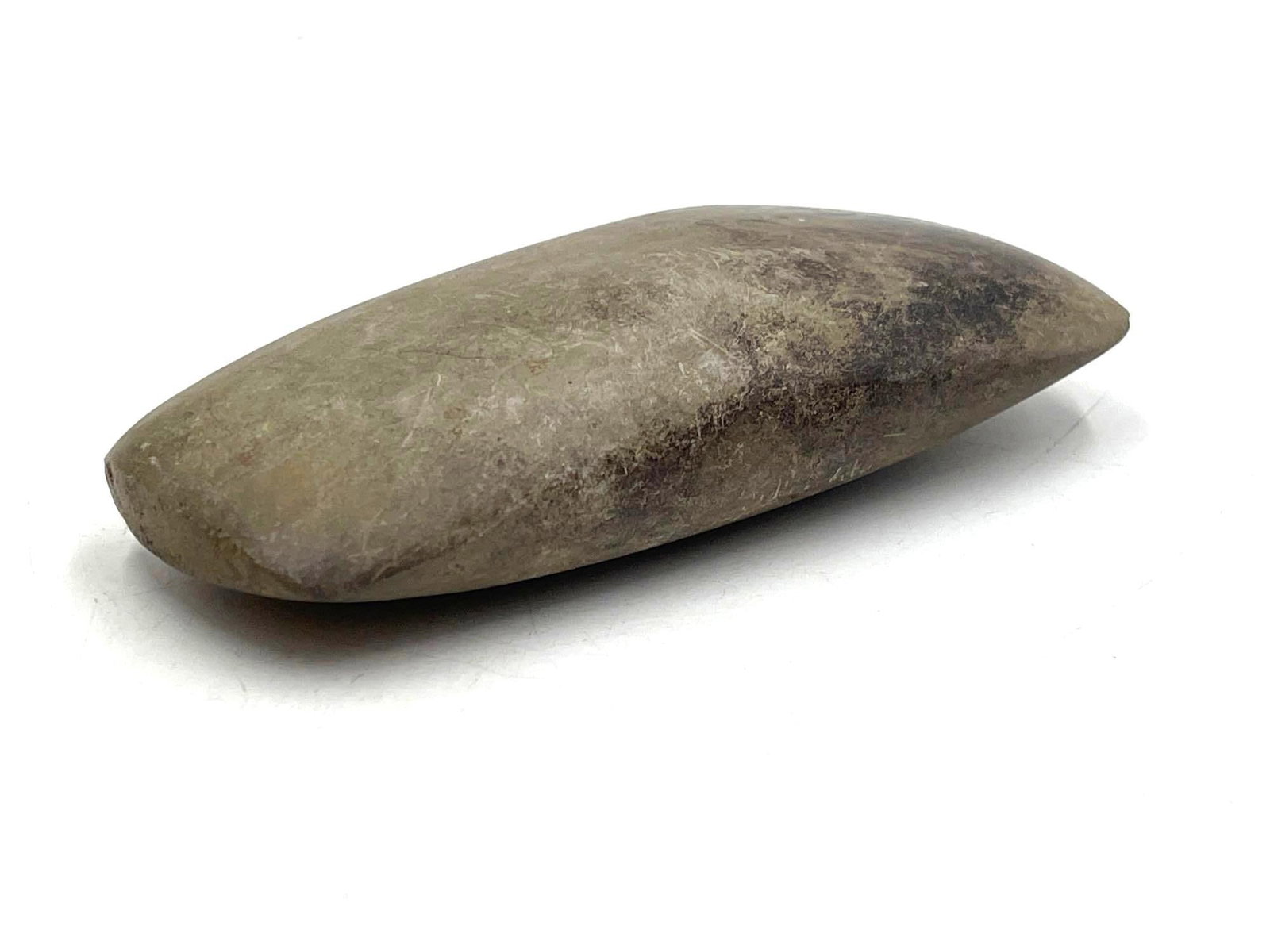 Stone Celt, Archaic/Woodland Period: Stone Celt. A stone celt was found along the South River in Augusta County, Virginia in the 1930s. Circa the Archaic or Woodland Period. It measures 5 x 2 x 1 inches. It measures 5.5 x 2.5 x 1 inches