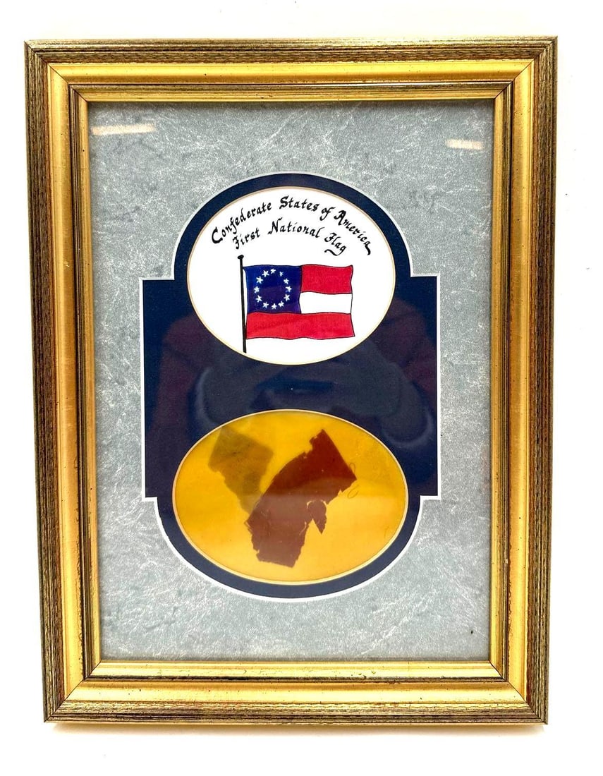 Confederate Flag Remnants: Confederate Flag Remnants. The remnants are from the First National Flag. It measures 8 5/8 X 7/8 X 11 3/8 inches. They are framed with an informational page on the back that reads: "The First Nationa